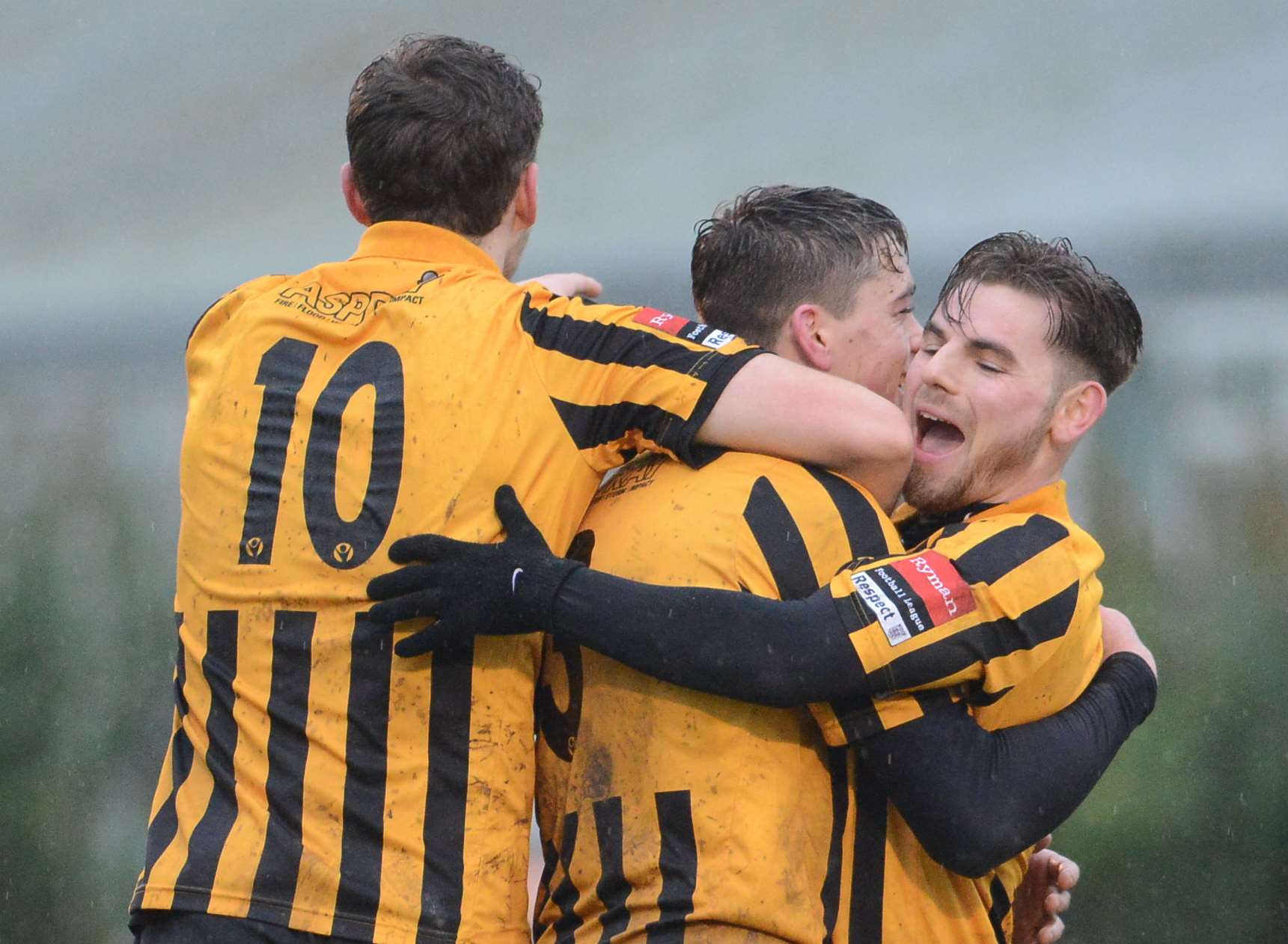 Harry Smith and Ashley Miller congratulate Callum Wraight on his goal against Sitttingbourne Picture: Gary Browne