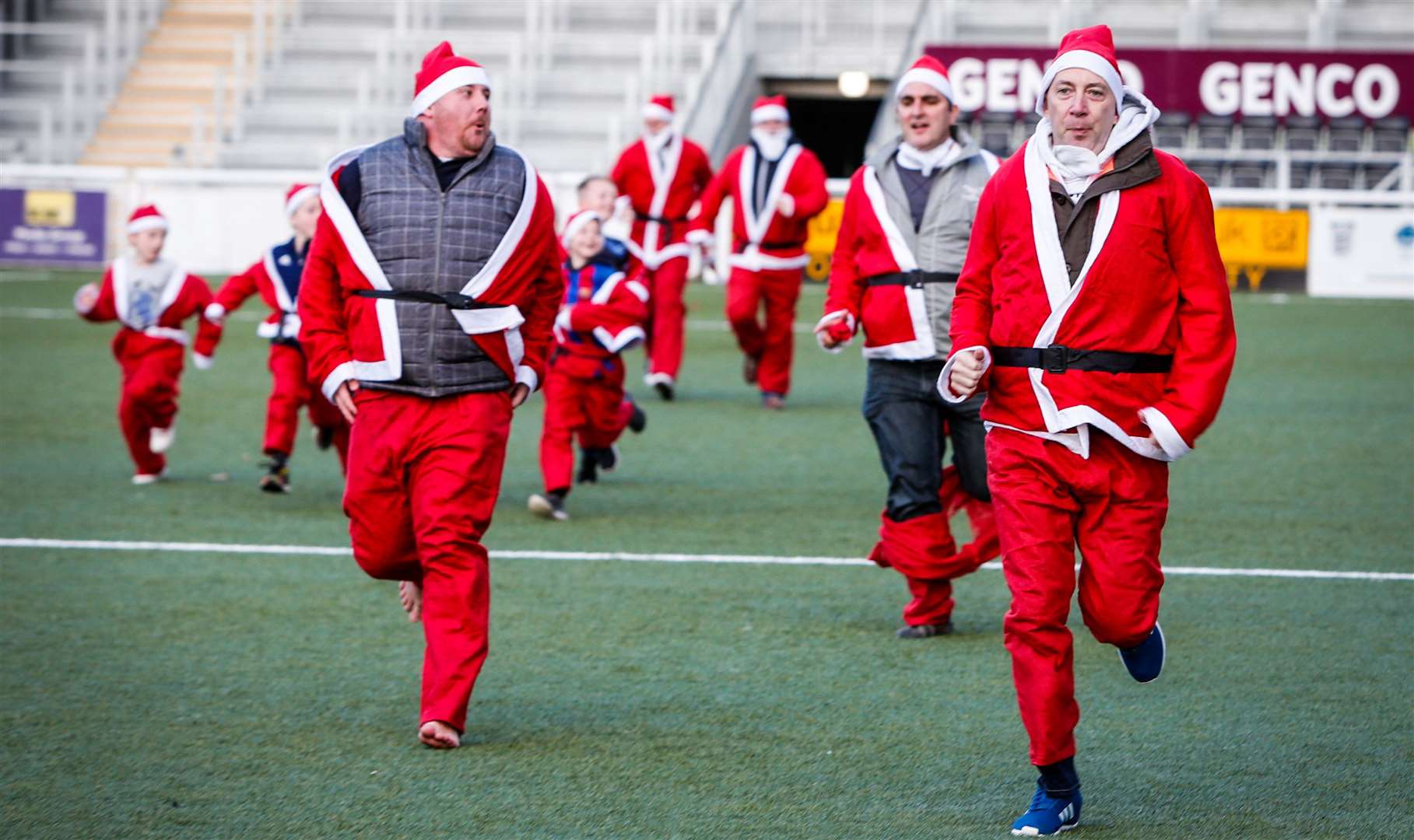 Dashing through the... football pitch for the Heart of Kent Hospice Picture: Matthew Walker