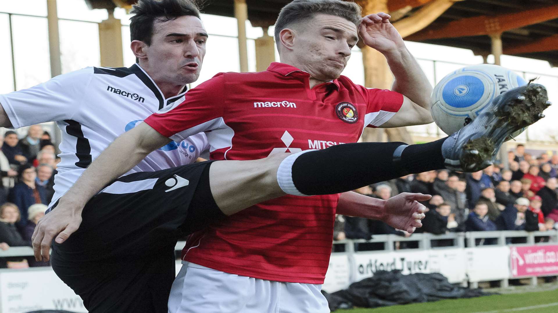 Dartford's Danny Harris get his foot to the ball ahead of Fleet's Jack Connors. Picture: Andy Payton