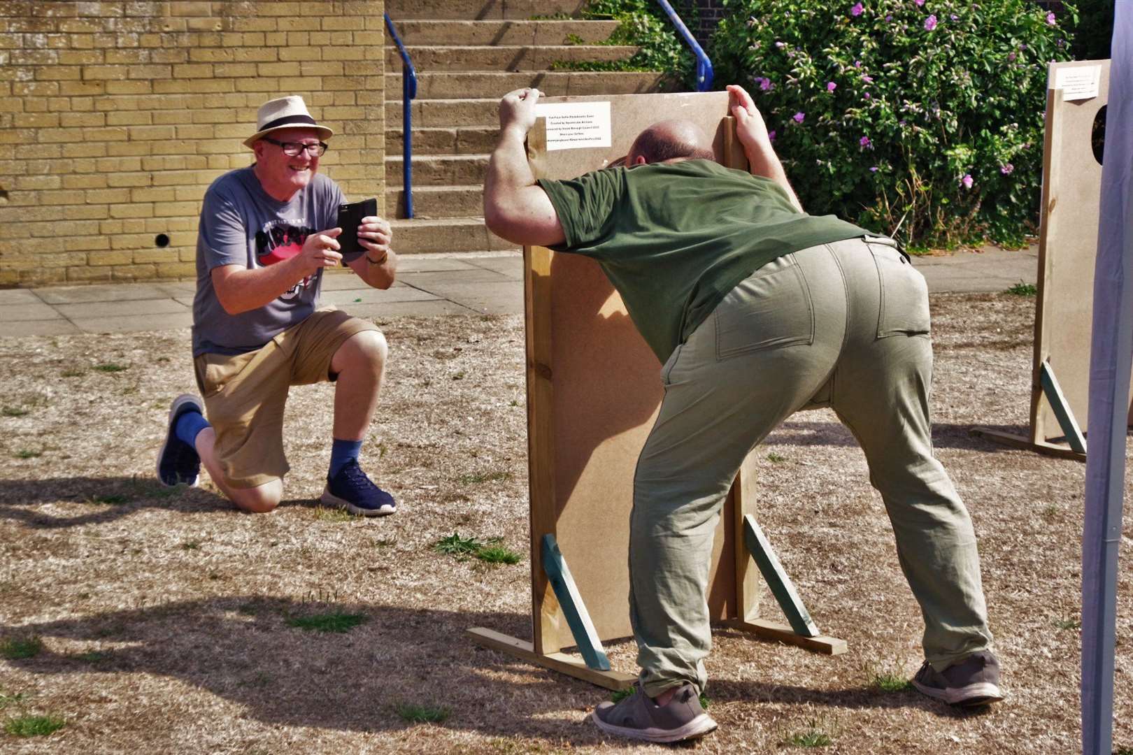 Artist Richard Jeferies gets his photo taken at his display of funny faces in Beachfields as part of the Sheerness Festival of the Sea. Picture: Phil Crowder