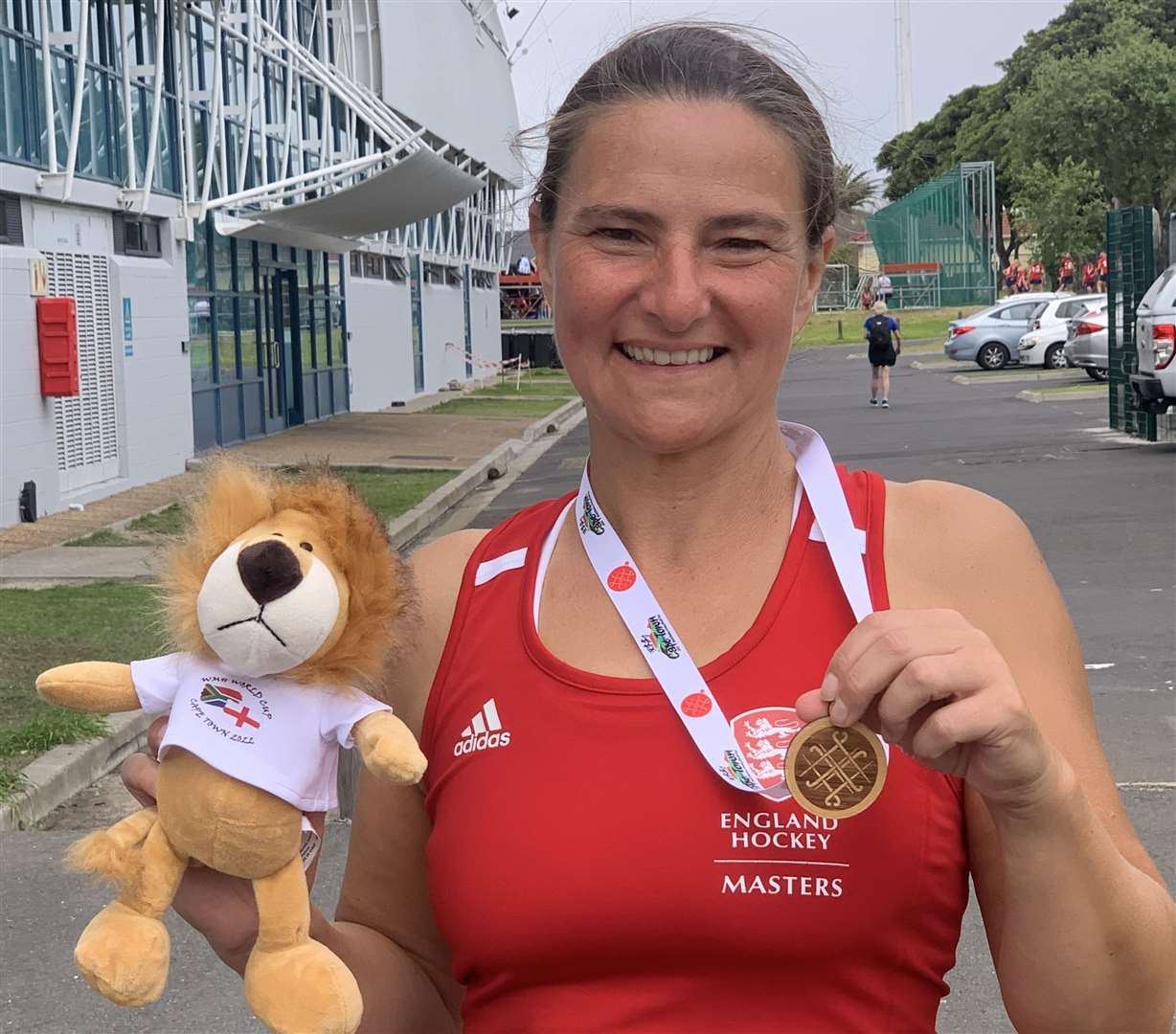 Masters World Cup winner Claire Hales with her player-of-the-match Lion and victory medal