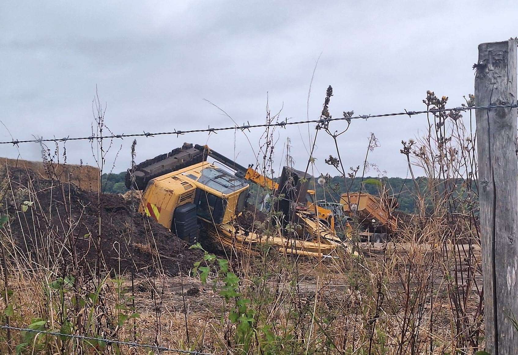 The digger ended up on its side in Ladds Lane, Snodland. Picture: Paul Chapman