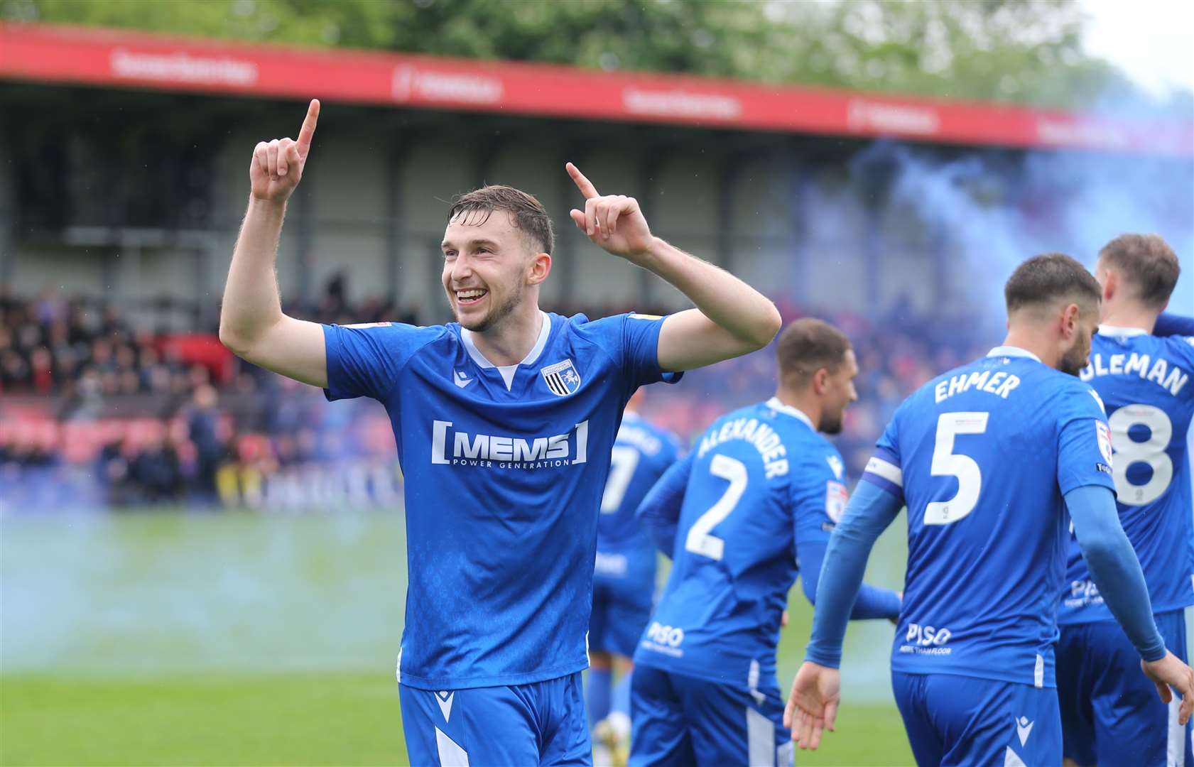 Gillingham defender Conor Masterson enjoying the late goal from Cheye Alexander