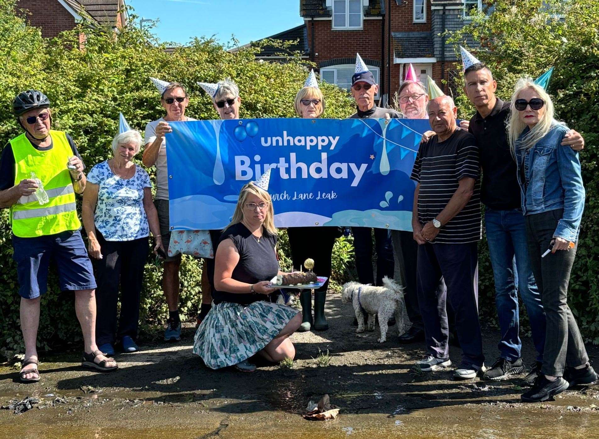 Residents in Seasalter celebrated the unhappy second birthday of the leak in Church Lane