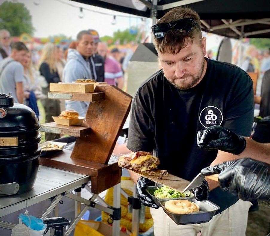 Mr Sproston making one of his many burgers. Picture: The Grumpy Dads Grill