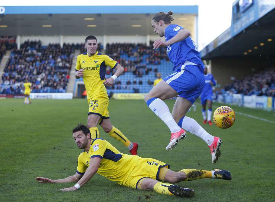 Tom Eaves is challenged for the ball Picture: Andy Jones