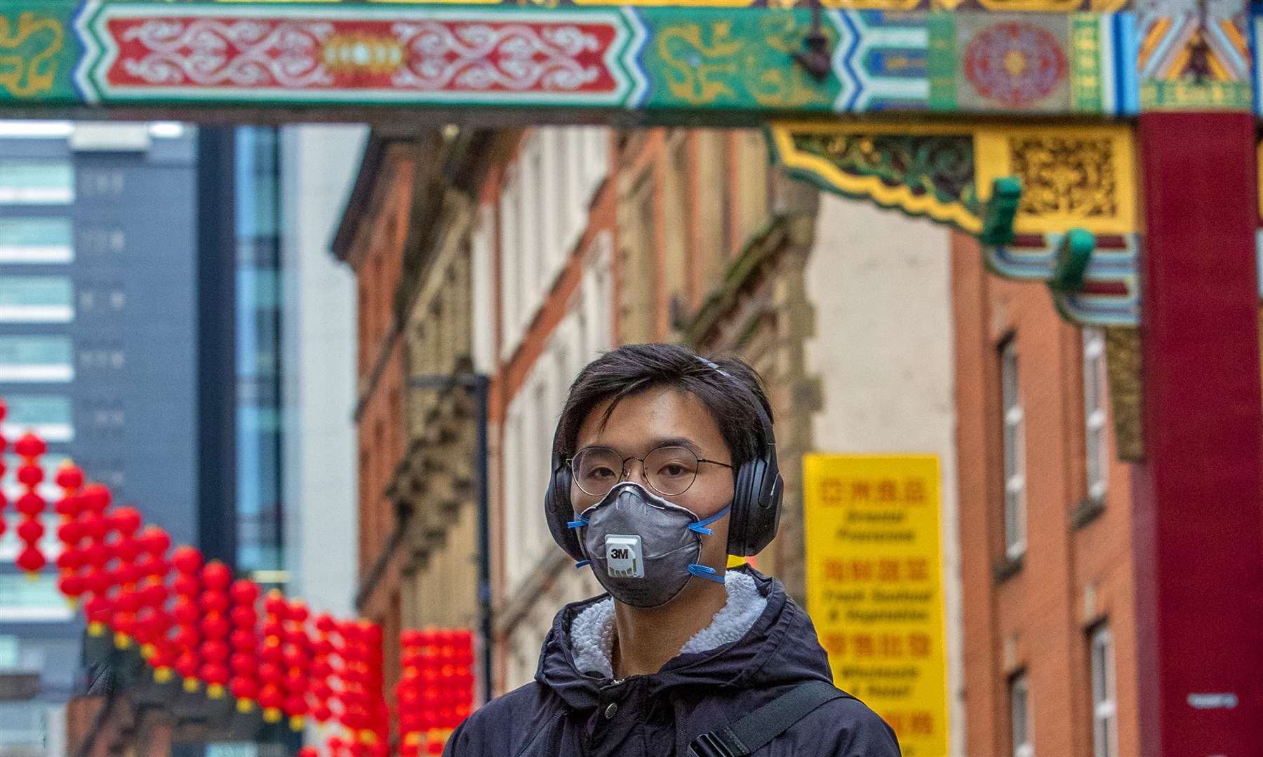 A member of the Chinese community in Manchester wearing a face mask in January (Peter Byrne/PA)