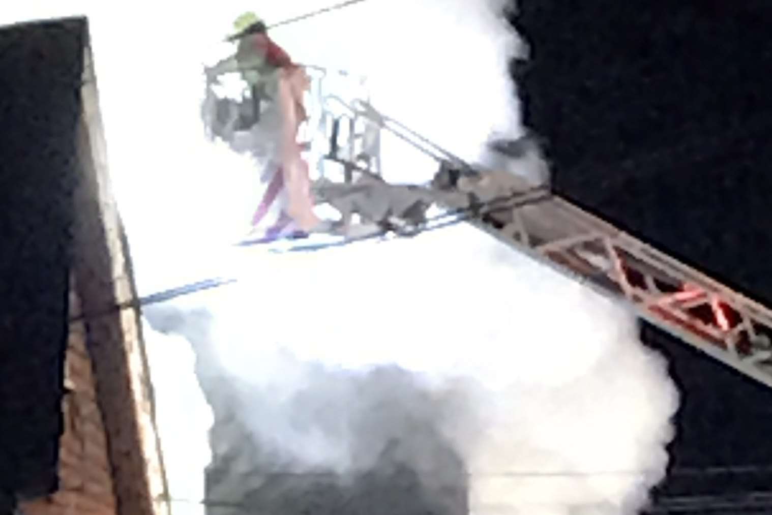 A firefighter is engulfed in smoke. Pic: Robert Gibbs