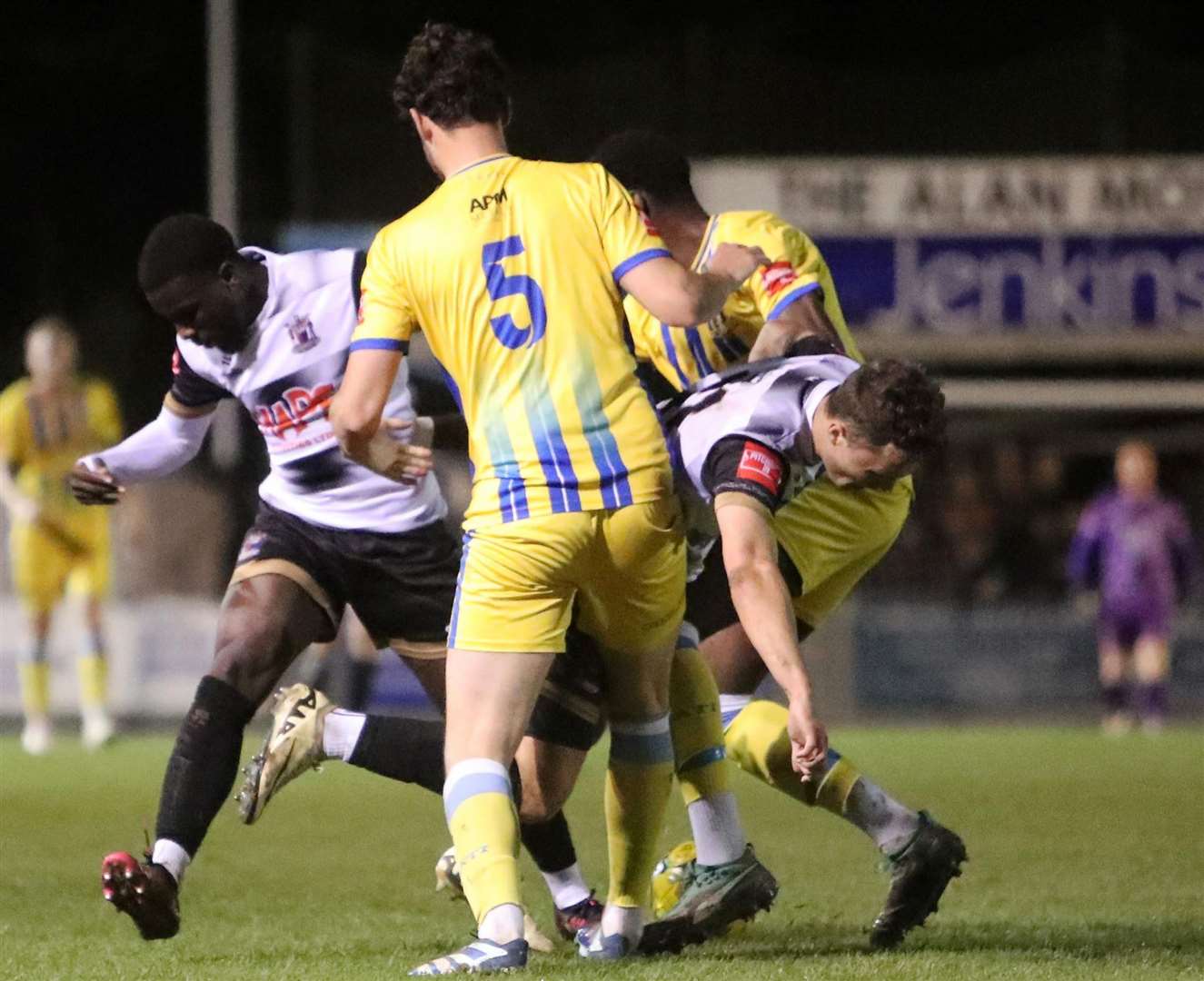 Deal duo Rory Smith and substitute Ife Oni are crowded out by Sittingbourne's Jack Steventon. Picture: Paul Willmott