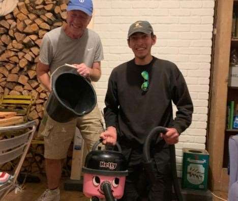 Gabriel Mackie and Andrew Sumner at work pumping flood water from Kent museum of Moving Image