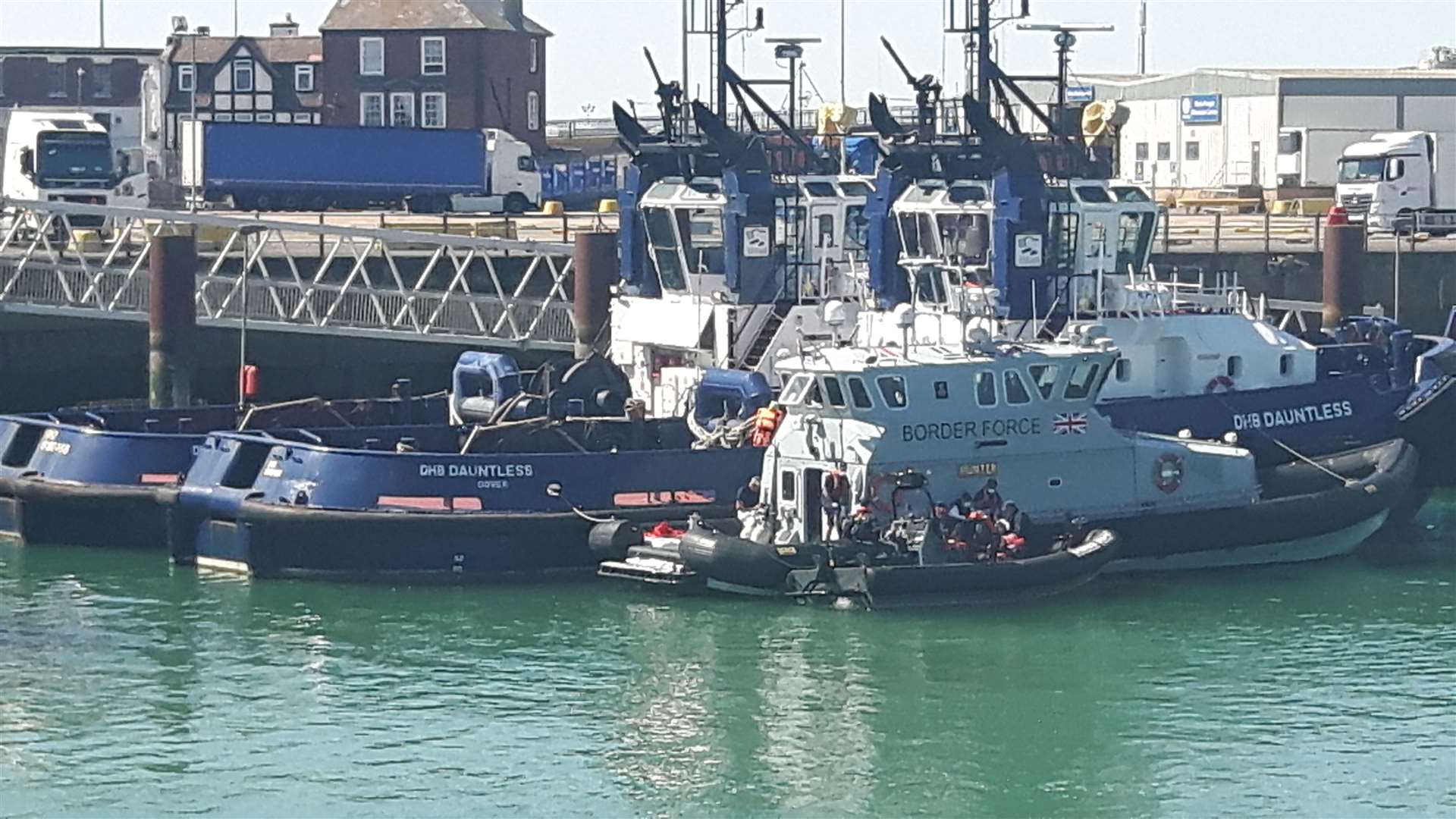 Women and children were at the front of the RHIB. One child was seen clapping as the boat came in to port