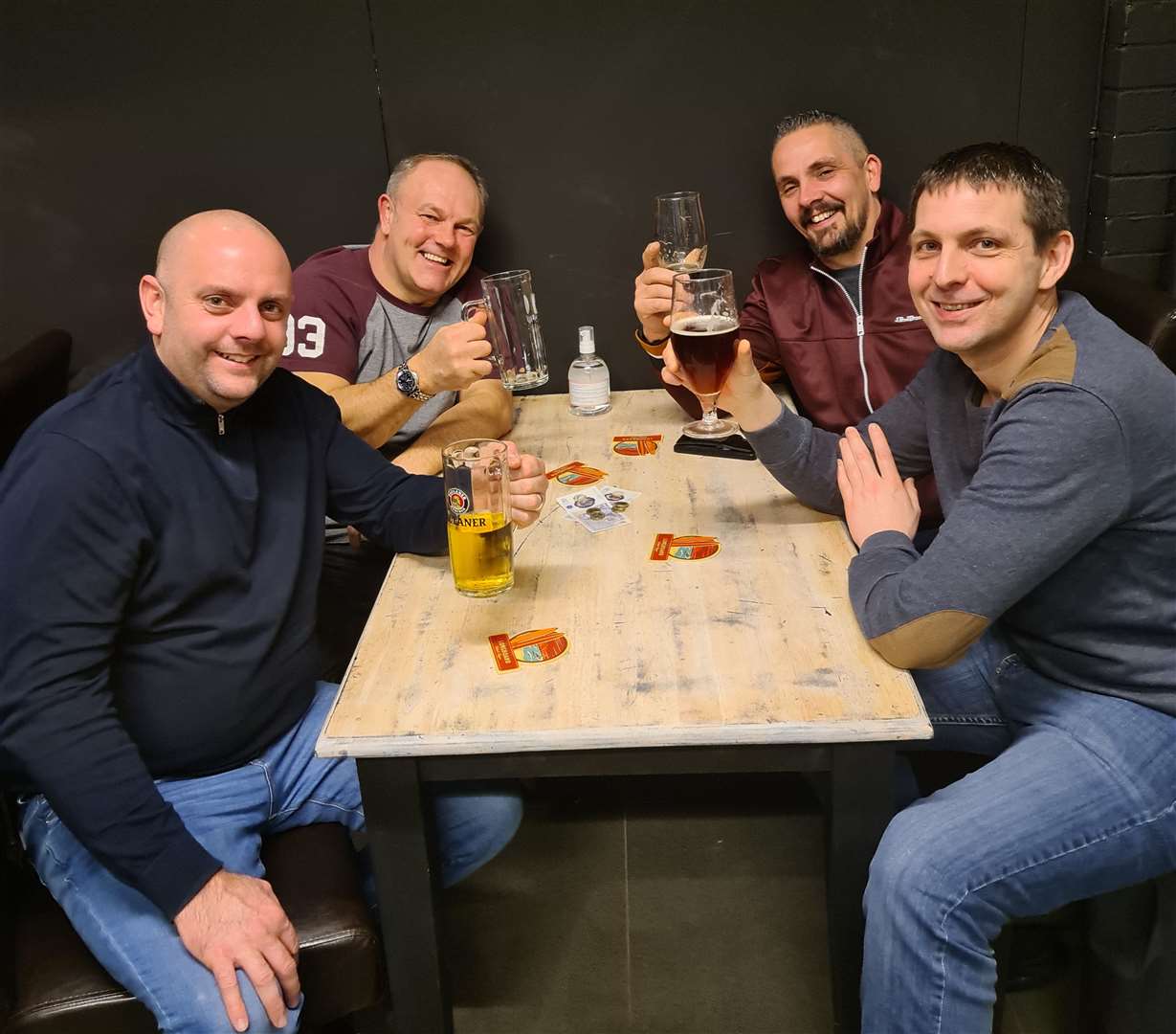 Beer fans sampling the range on offer at The Growler Stop