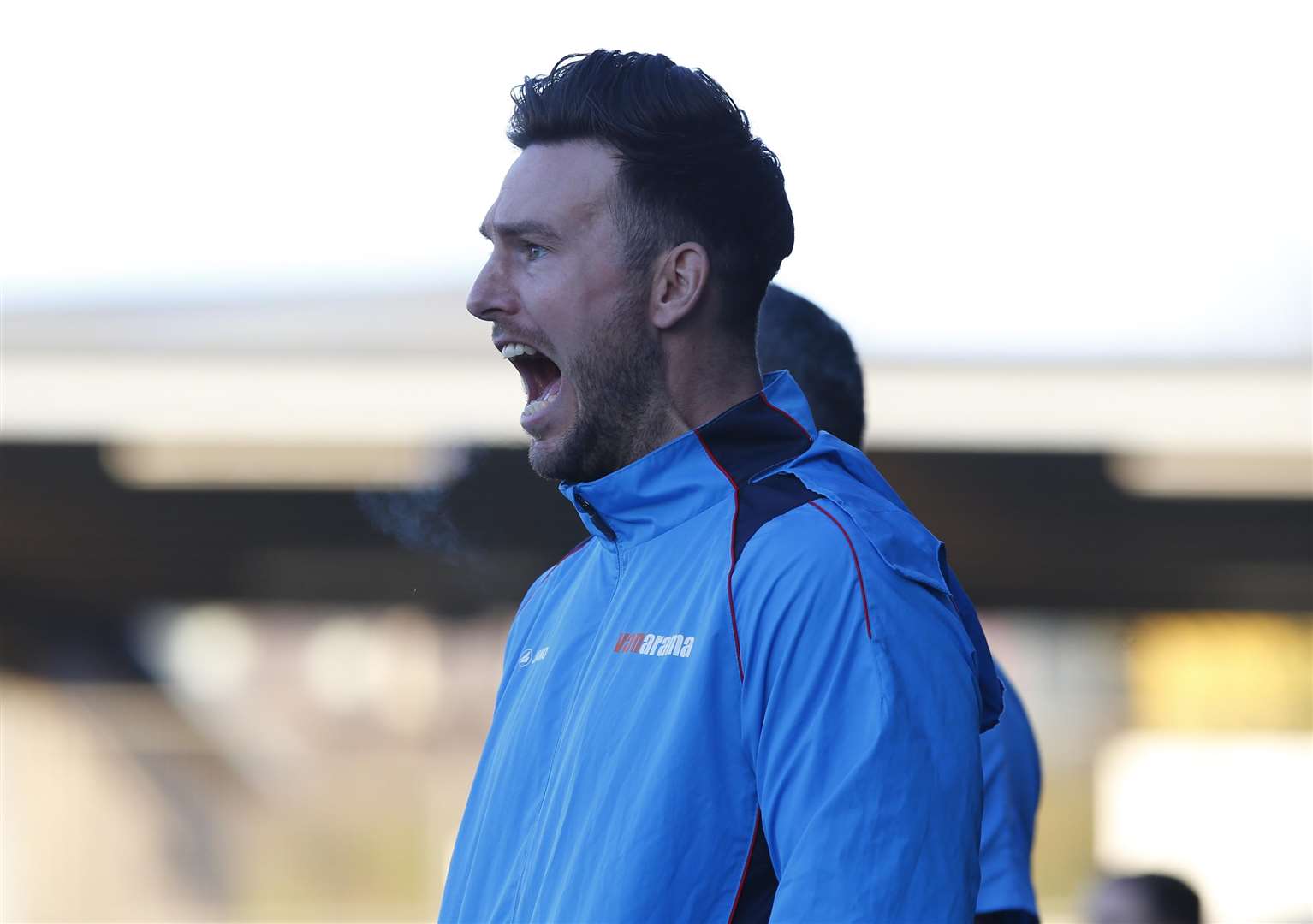 Jamie Coyle barks out instructions from the sidelines against Woking Picture: Andy Jones