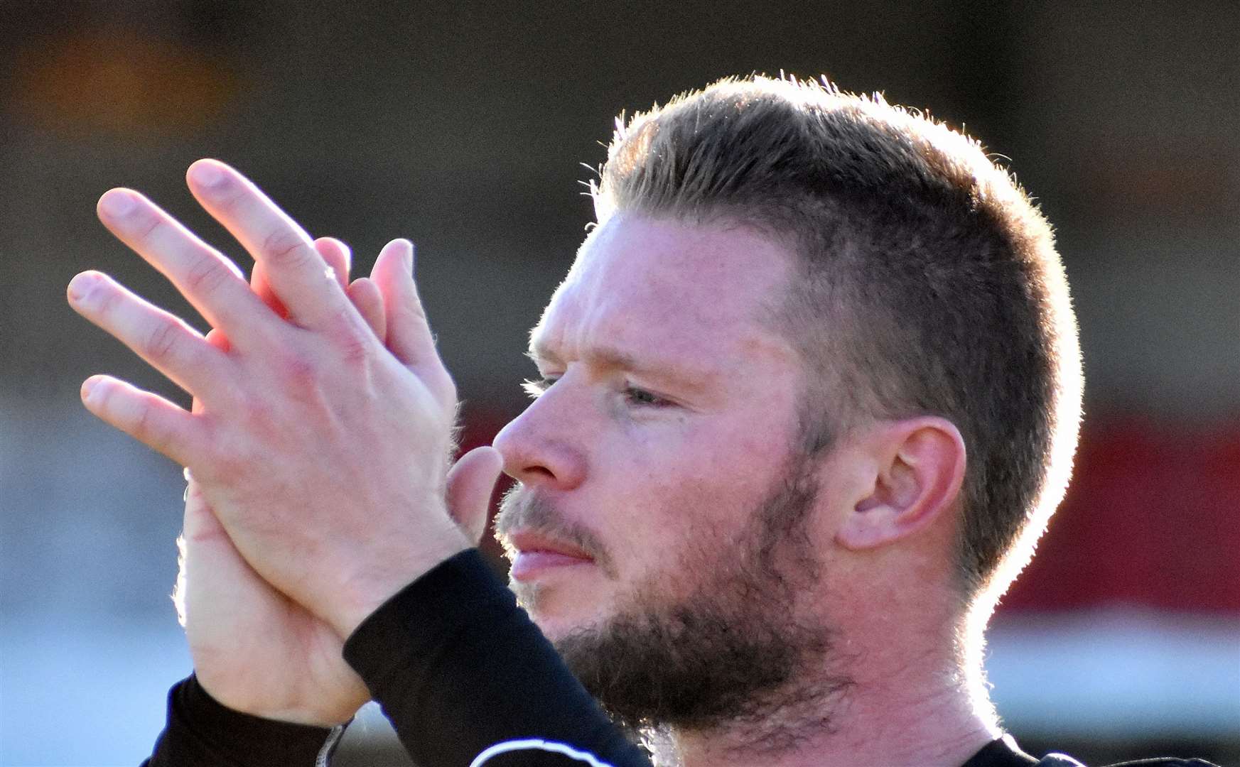 Folkestone midfielder Scott Heard applauds the fans. Picture: Randolph File