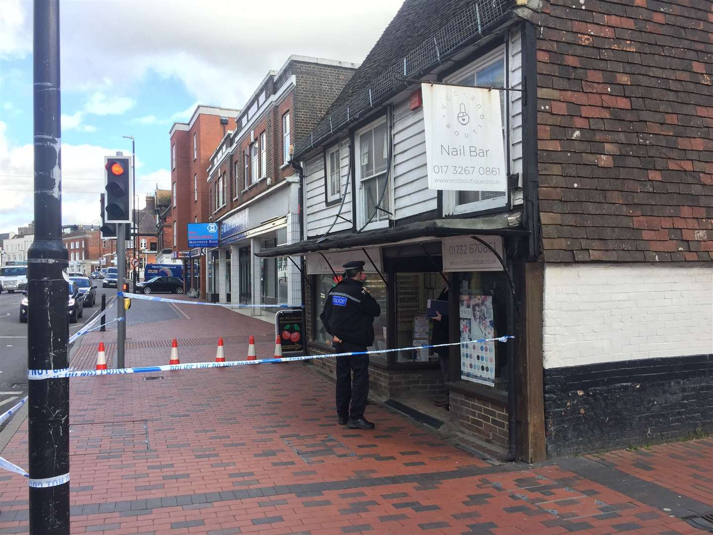 Police outside the nail bar in Tonbridge High Street at the time of the incident