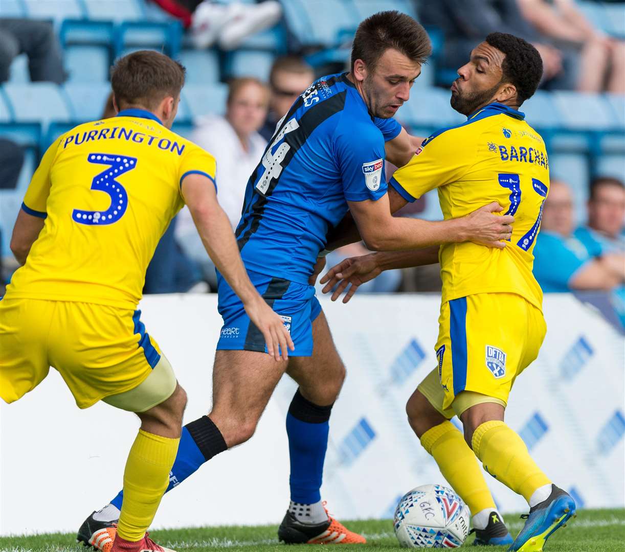 Josh Rees tangles with former Gill Andy Barcham on the touchline Picture: Ady Kerry