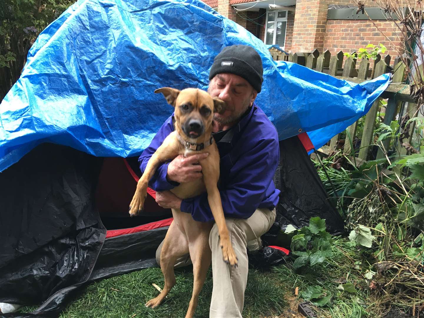 Paul Wallis and his dog Cali are sleeping in a tent after being evicted (9897876)