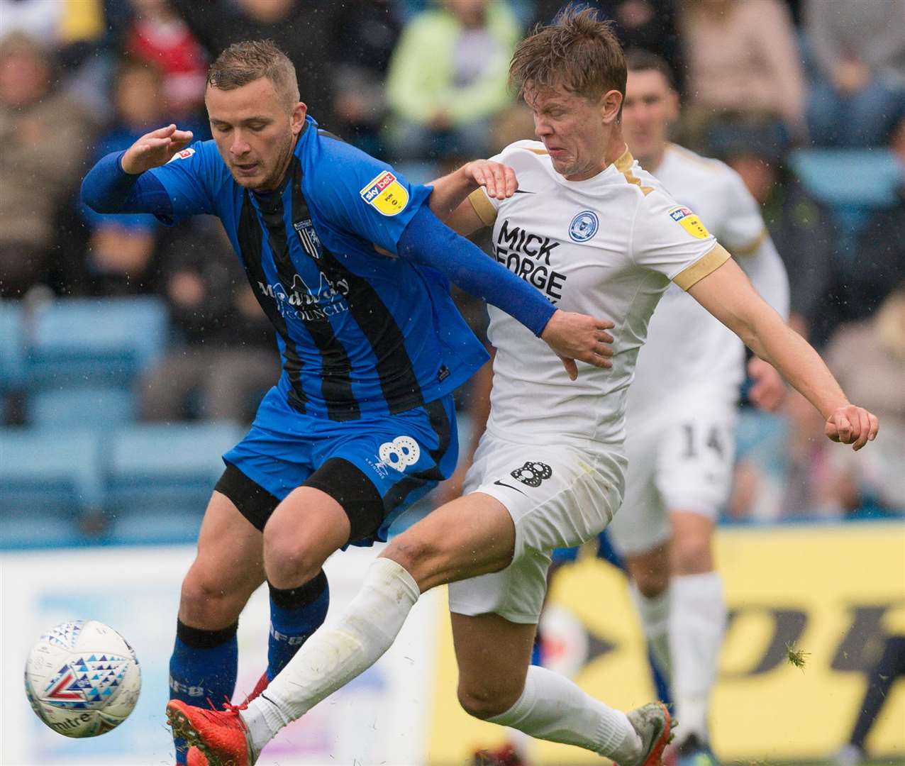 Dean Parrett gets stuck in against Peterborough's Mark O'Hara Picture: Ady Kerry