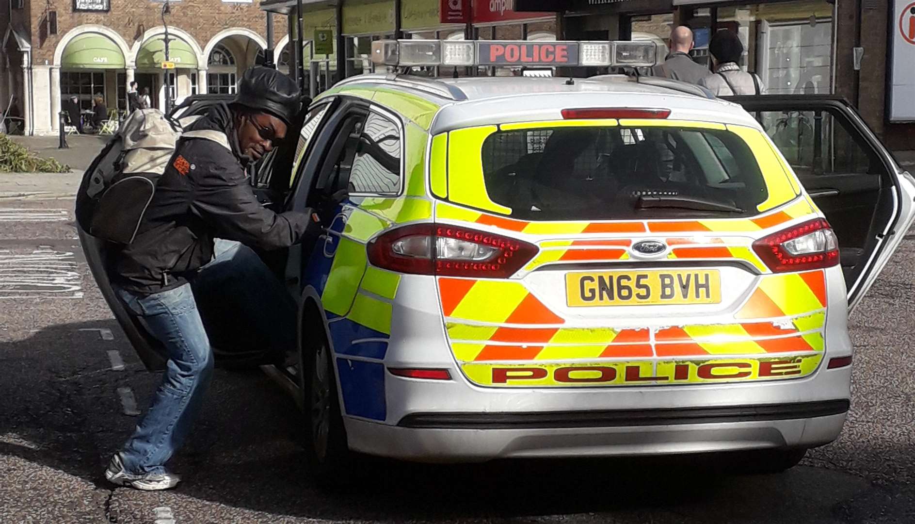 A curious member of the public explores the unguarded car.