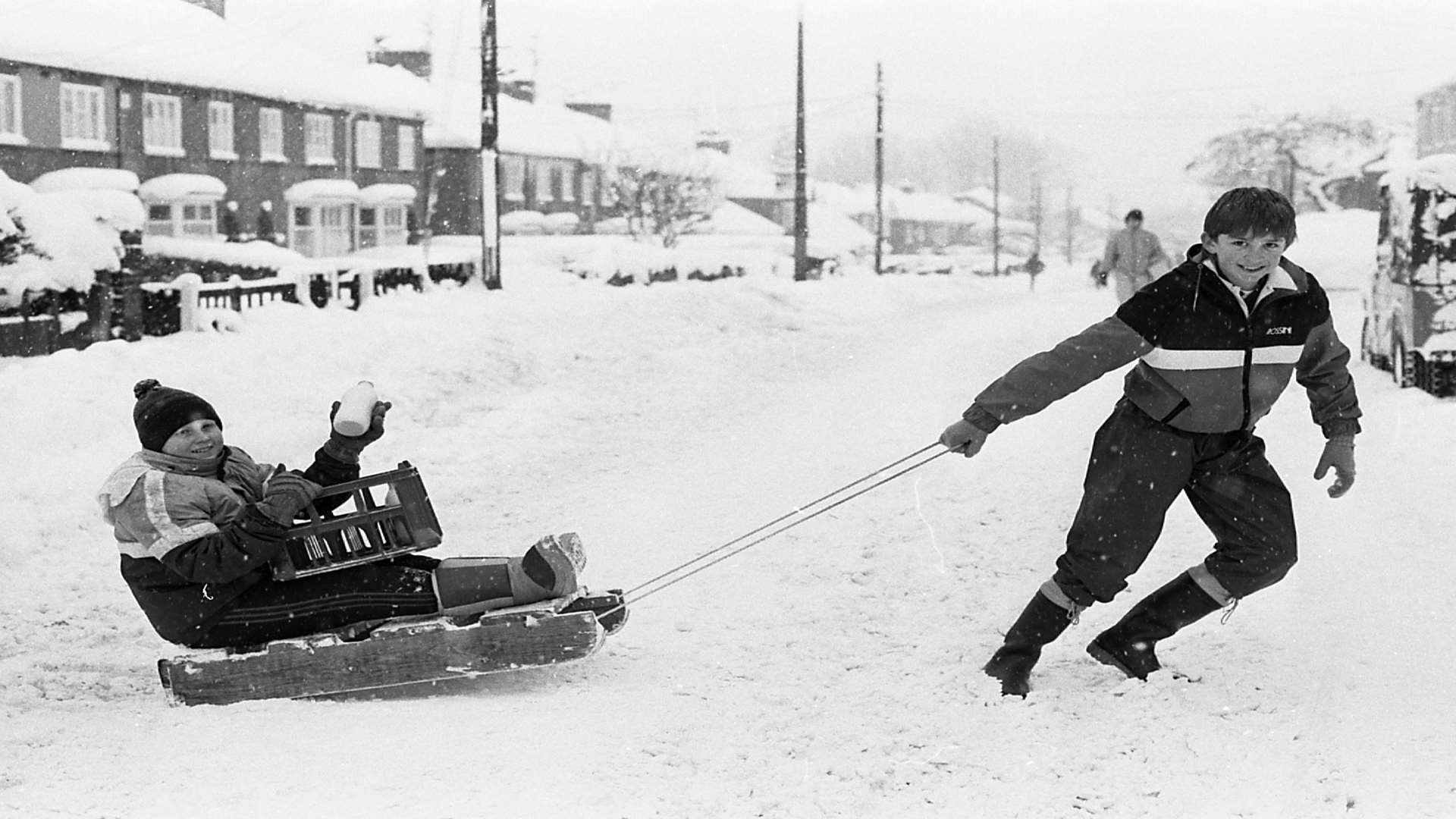 Boys on the Isle of Sheppey find a unique way to take a bottle of milk home. Picture: Barry Hollis