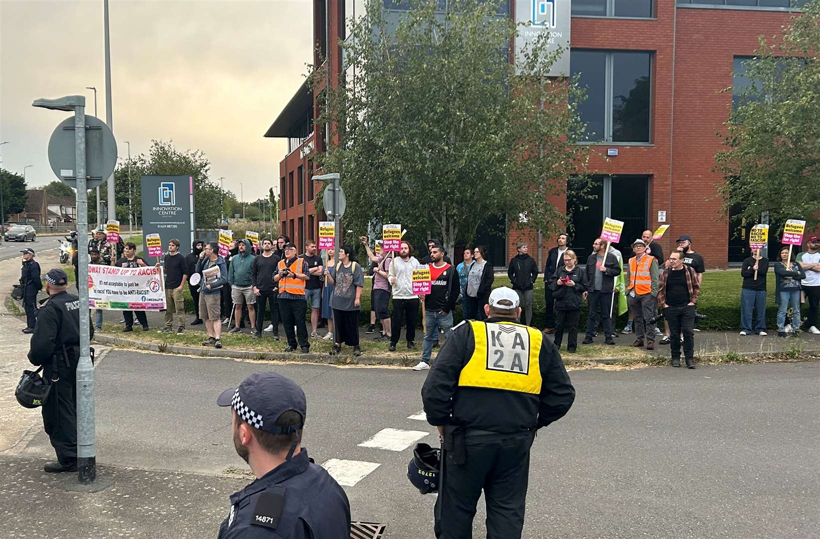 People have gathered near the Chatham Innovation Park and Holiday Inn