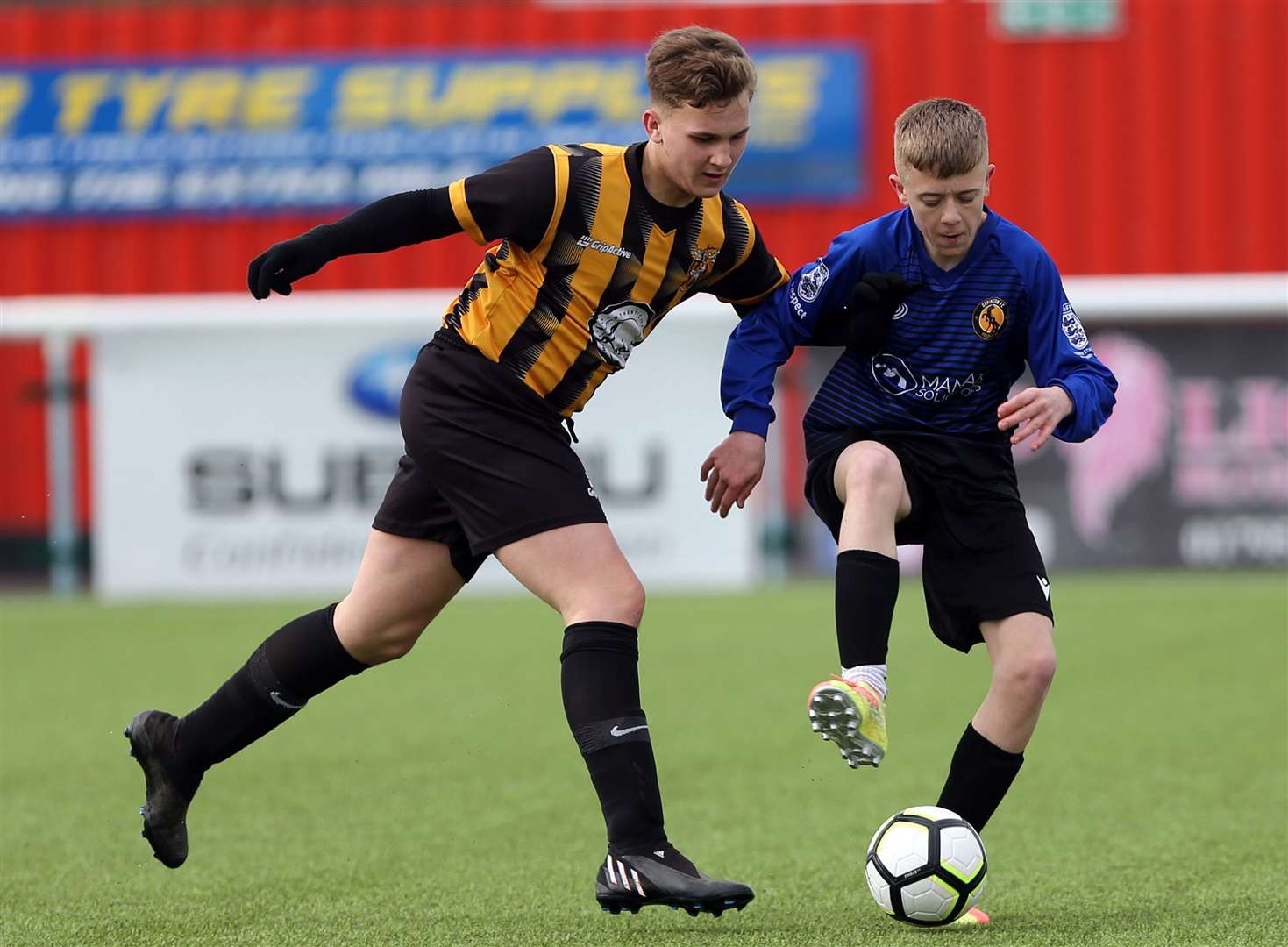 Orpington (blue) hold off Folkestone Invicta during the Kent Merit Under-13 Boys Plate Final. Picture: PSP Images