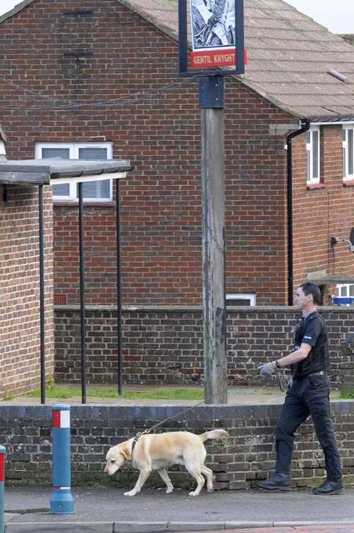 Police officer and a search dog outside the Gentil Knyght