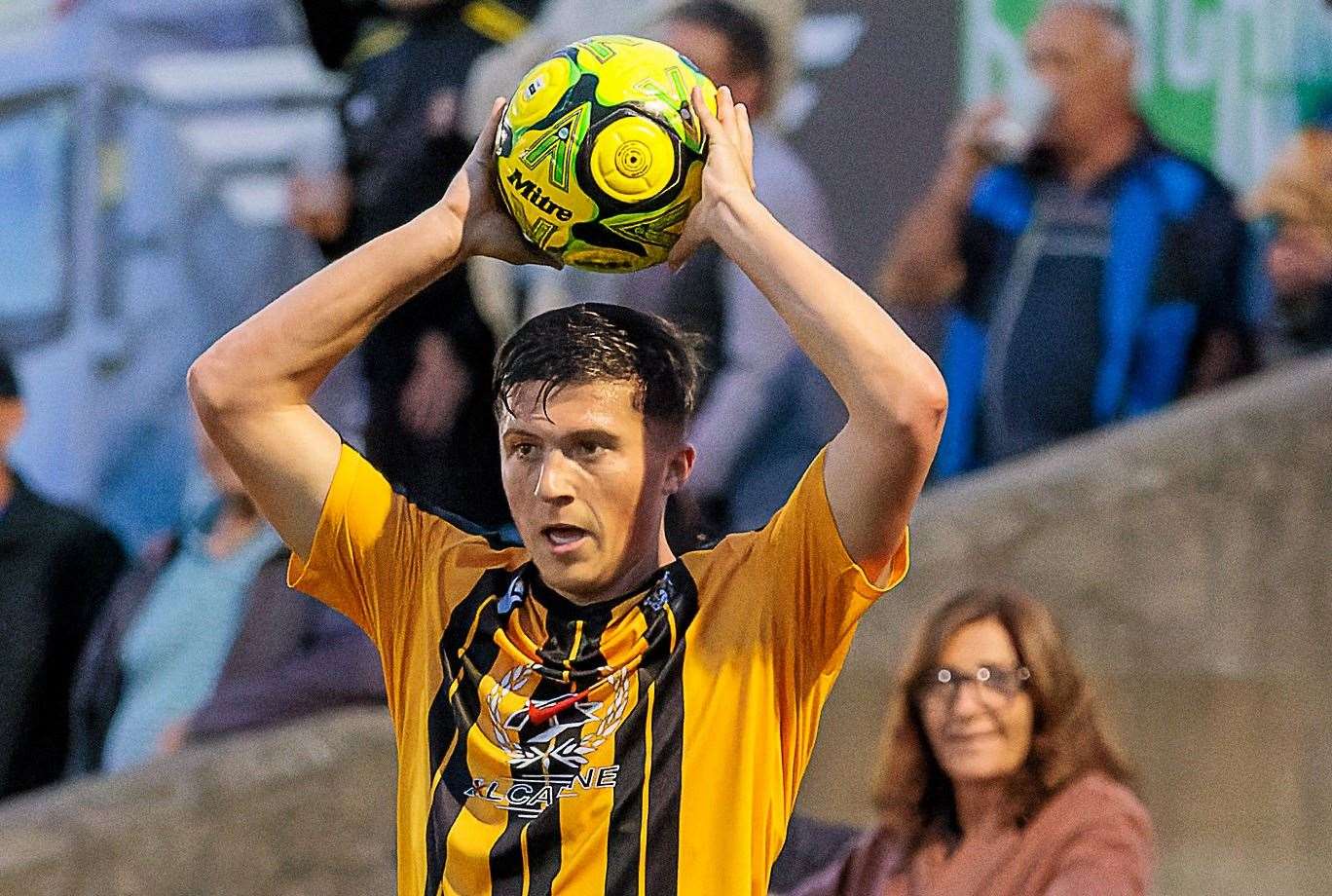 Folkestone's Frankie Morgan takes a throw-in. Picture: Helen Cooper