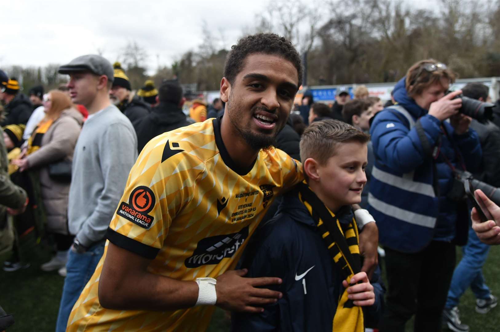 Maidstone winger Liam Sole celebrates with fans after beating Stevenage. Picture: Steve Terrell