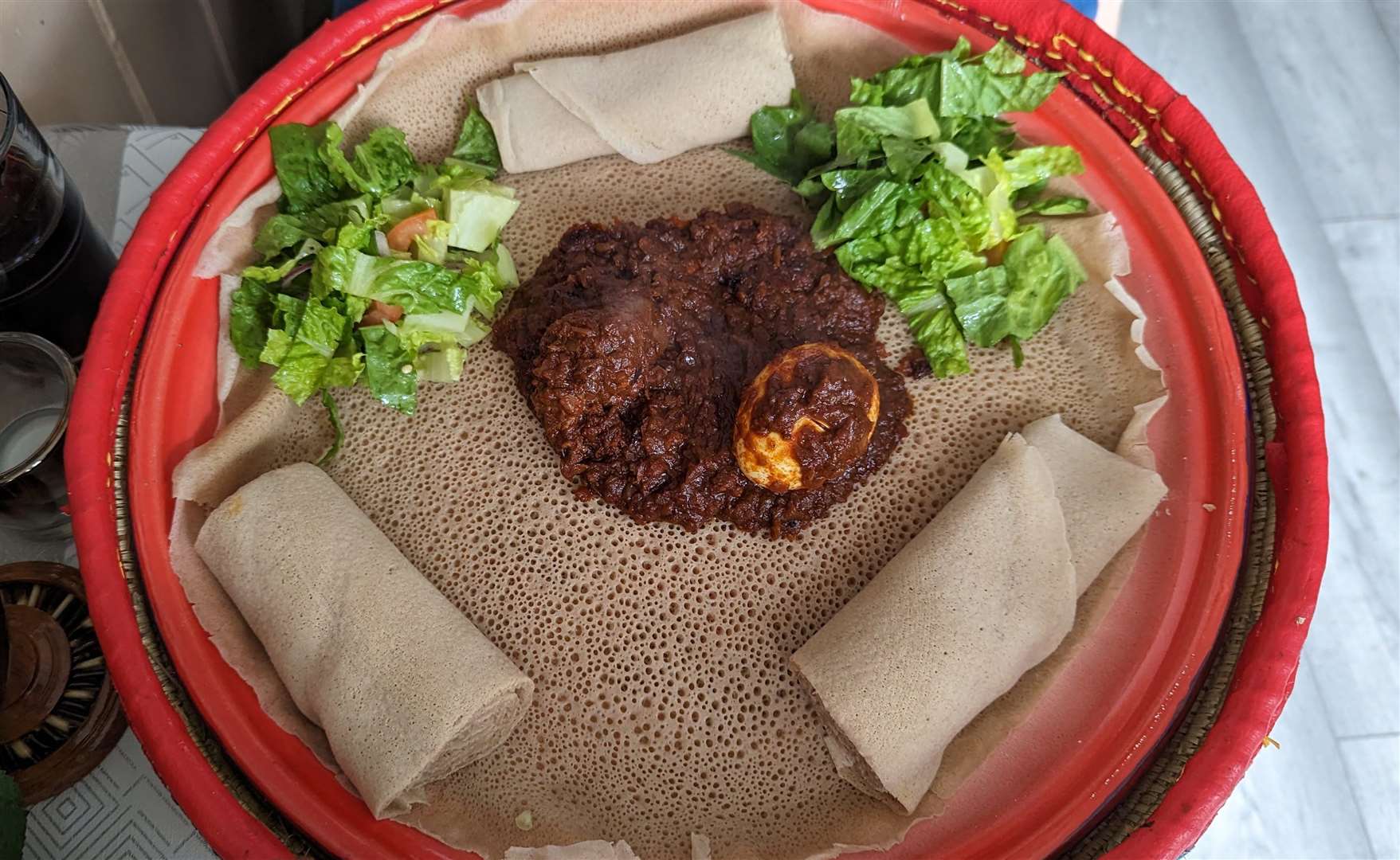 Zigni derho chicken stew served with injera bread