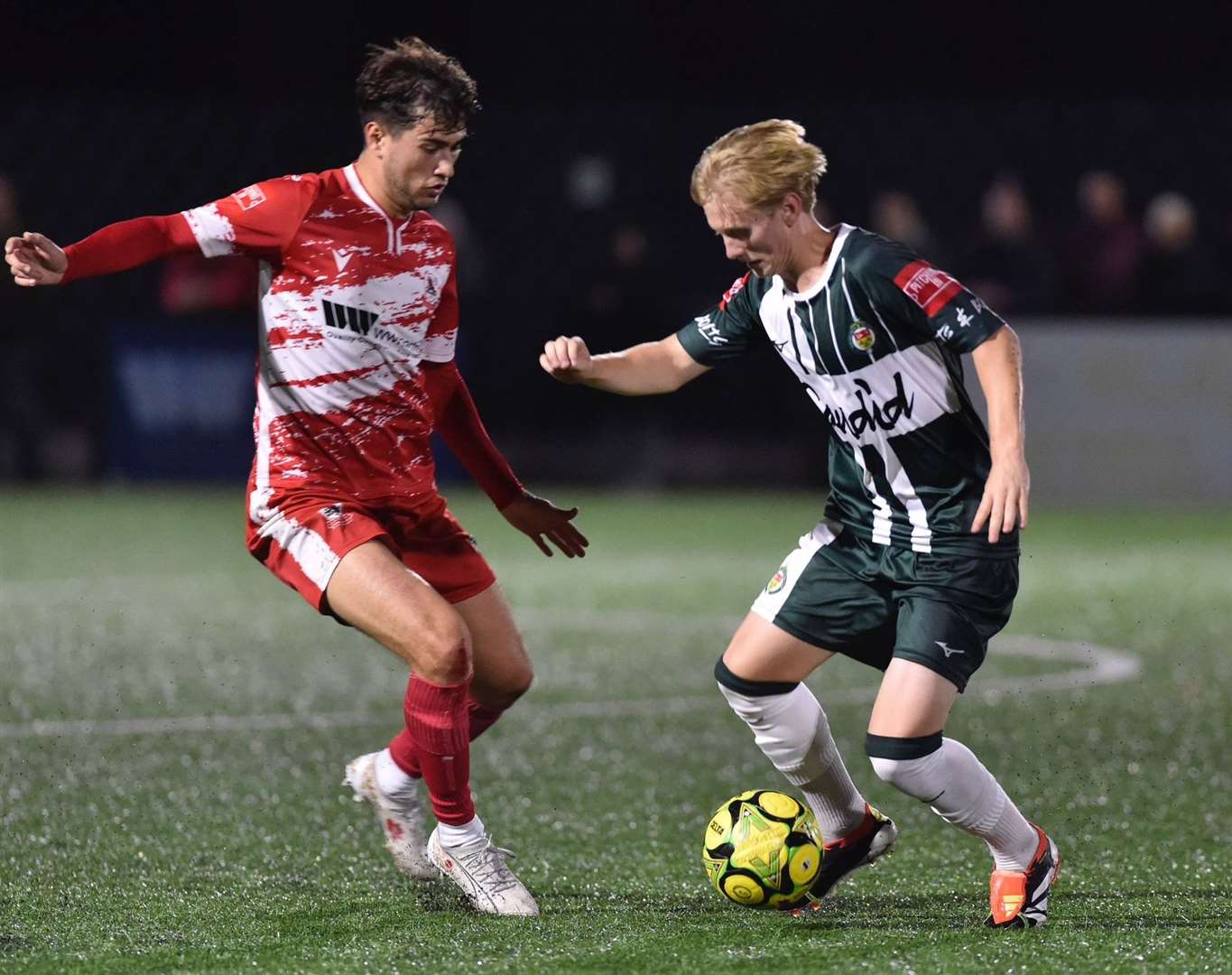 Ashford United midfielder Mikey Berry tries to find a way past Lewis Gard. Picture: Ian Scammell