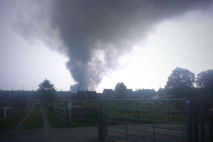 Clear blue skies were turned black as smoke poured from the blazing recycling centre in Milton Regis. Picture: Kate Taylor