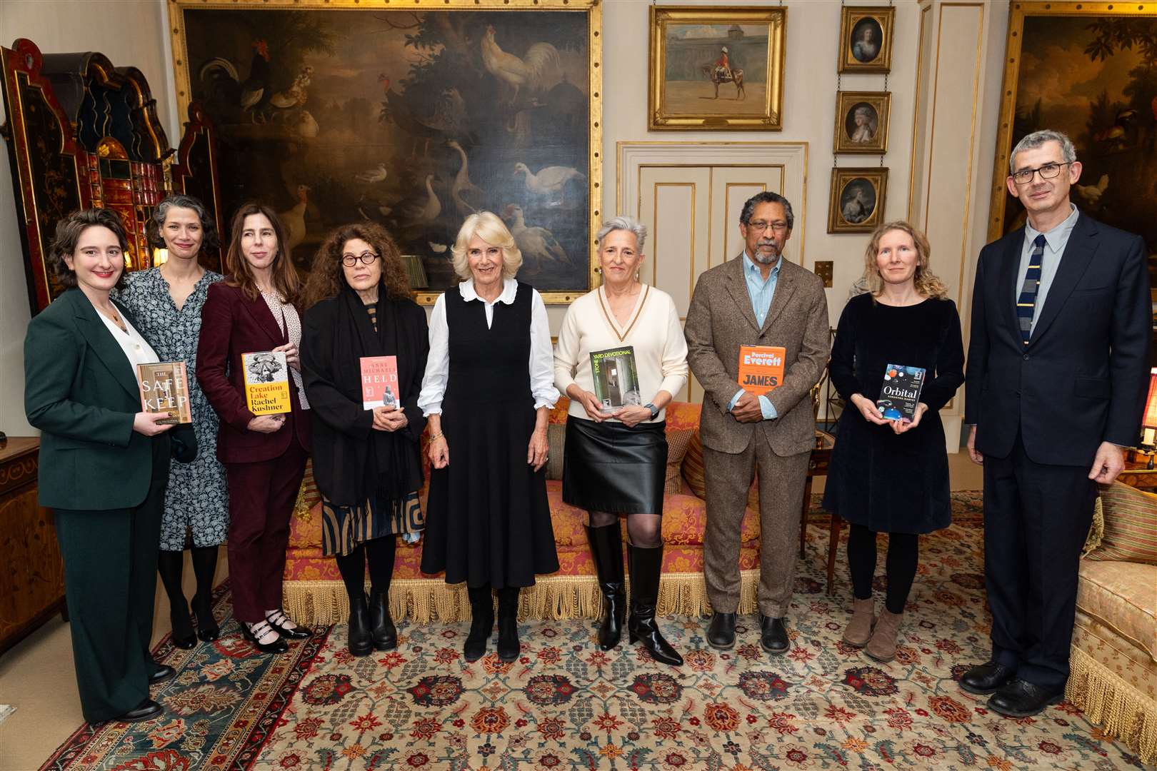 (left to right) Yael van der Wouden, Gaby Wood, Rachel Kushner, Anne Michaels, the Queen, Charlotte Wood, Percival Everett, Samantha Harvey, and Edmund de Waal (Aaron Chown/PA)