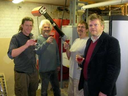 Ian Sargent, Ray Sprawson and Alan Greenwood from Bio Energy Technology toast the launch of the new heating system with Dover businessman John Shirley.