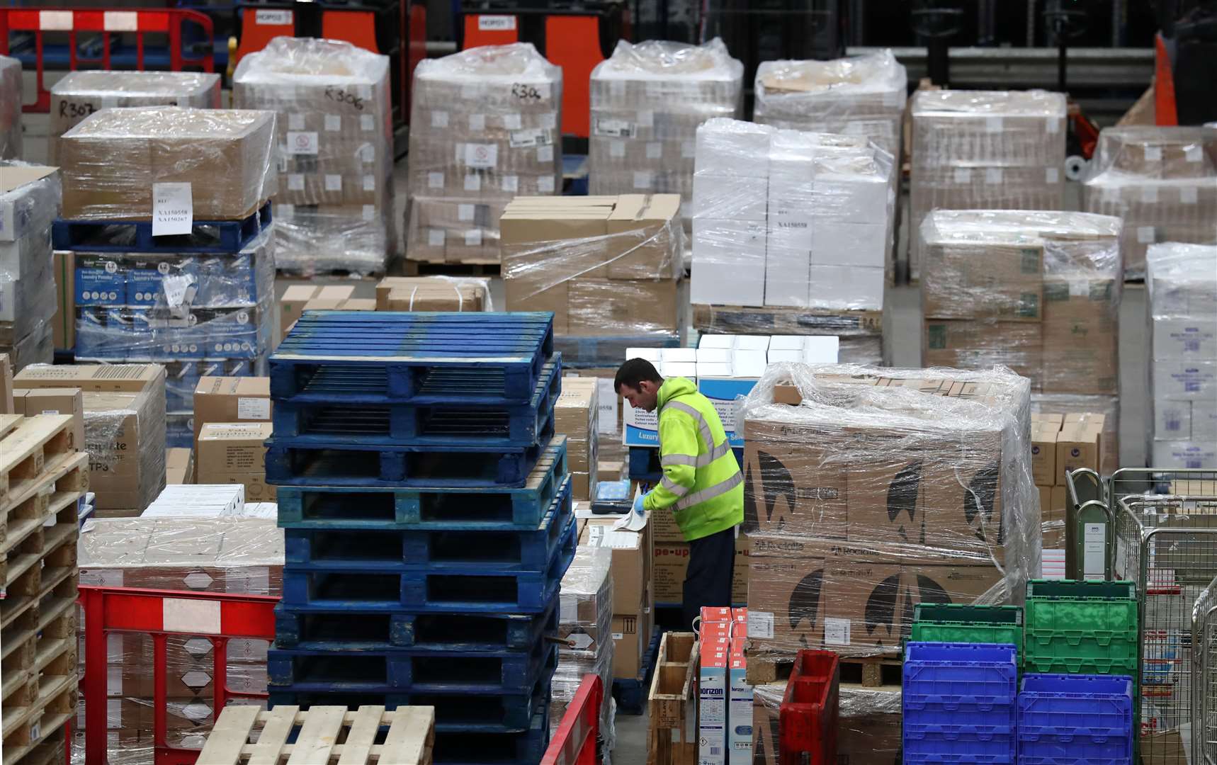 A worker gathers supplies at the NHS National Procurement Warehouse in Larkhall, Scotland (Andrew Milligan/PA)