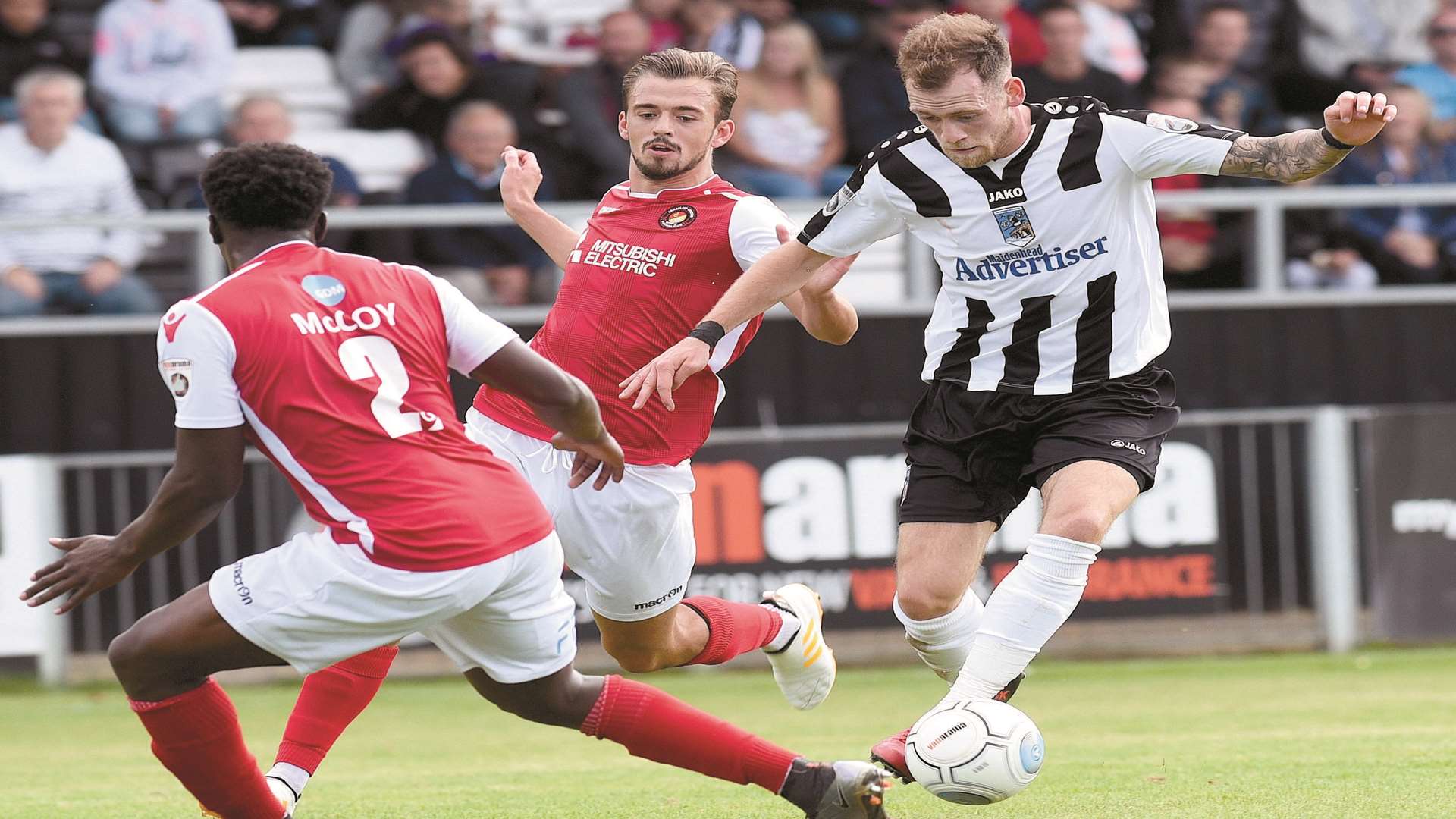 Marvin McCoy and Jack Powell try to stop Harry Pritchard Picture: Nick Parford (Baylis Media)