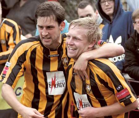 Liam Friend congratulates goalscorer Josh Burchell during Folkestone's victory over Hythe