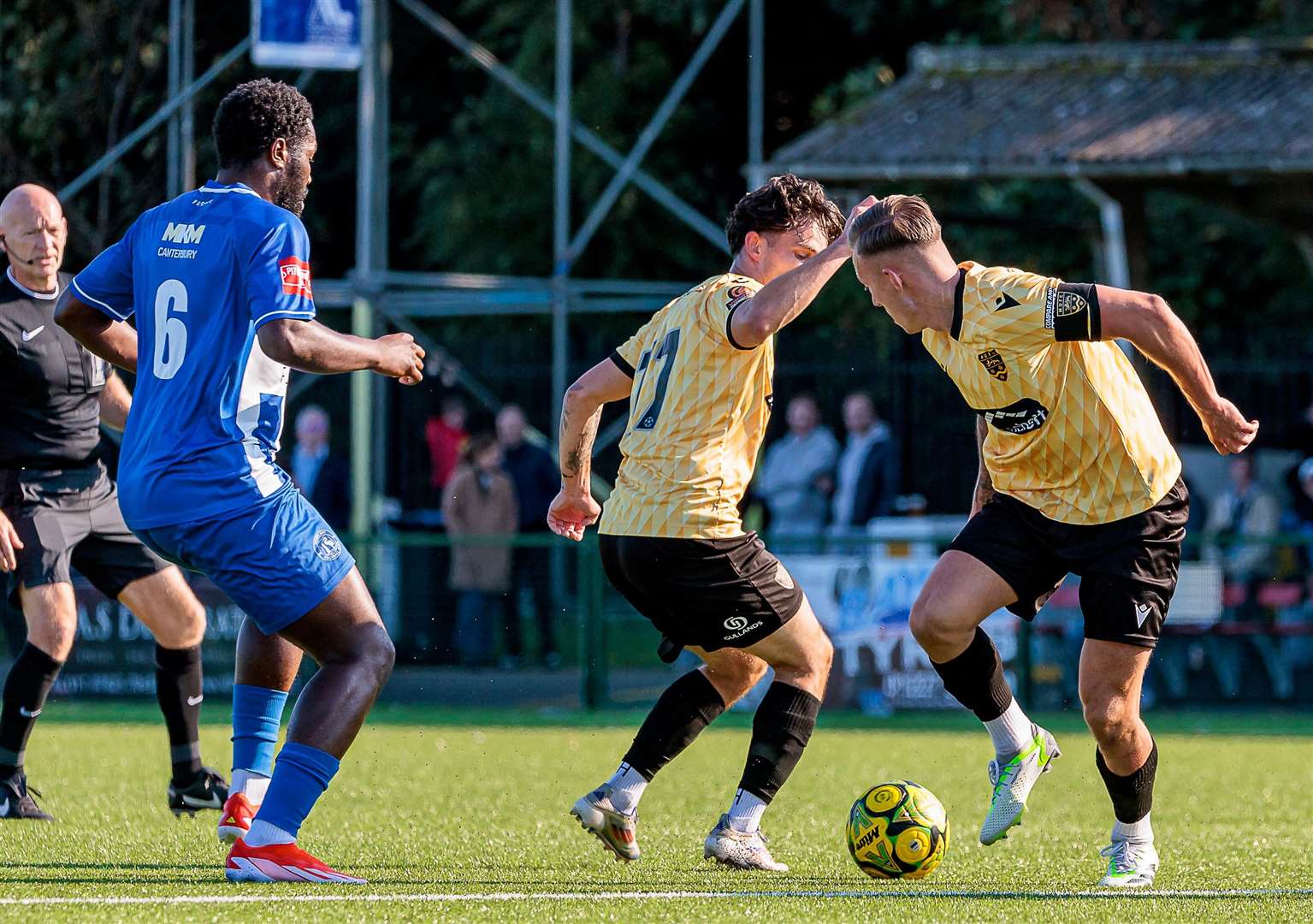 Maidstone captain Sam Corne and team-mate Jon Benton work together to get by Herne Bay's Mo Kamara as Bay were edged out 1-0 by their higher-division visitors in the FA Cup third qualifying round on Saturday. Picture: Helen Cooper