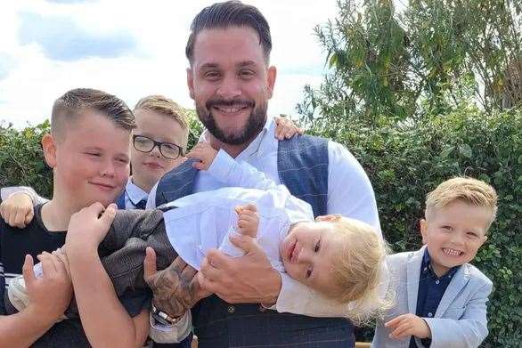 Rick Smith with his three children and stepson. Picture: Katrina Binfield