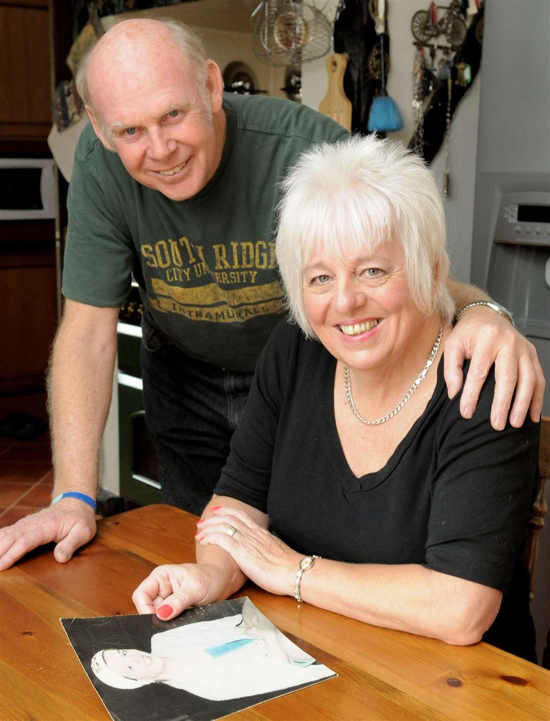 Linda, with husband Paul, looking at pictures from the 60's.Linda Ludgrove, of Brambledown, Sheppey, was a five-times Commonwealth Games gold medal winner for England in the 1960's.Picture: Andy Payton