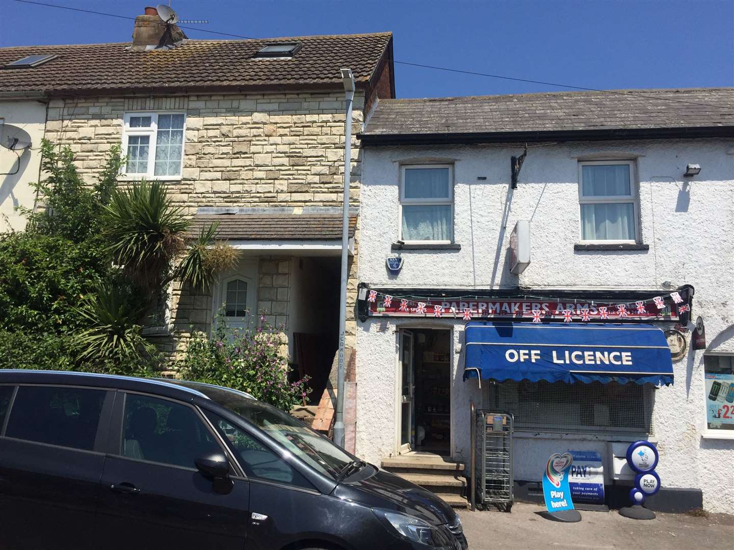 The house is next to the Papermakers Arms shop