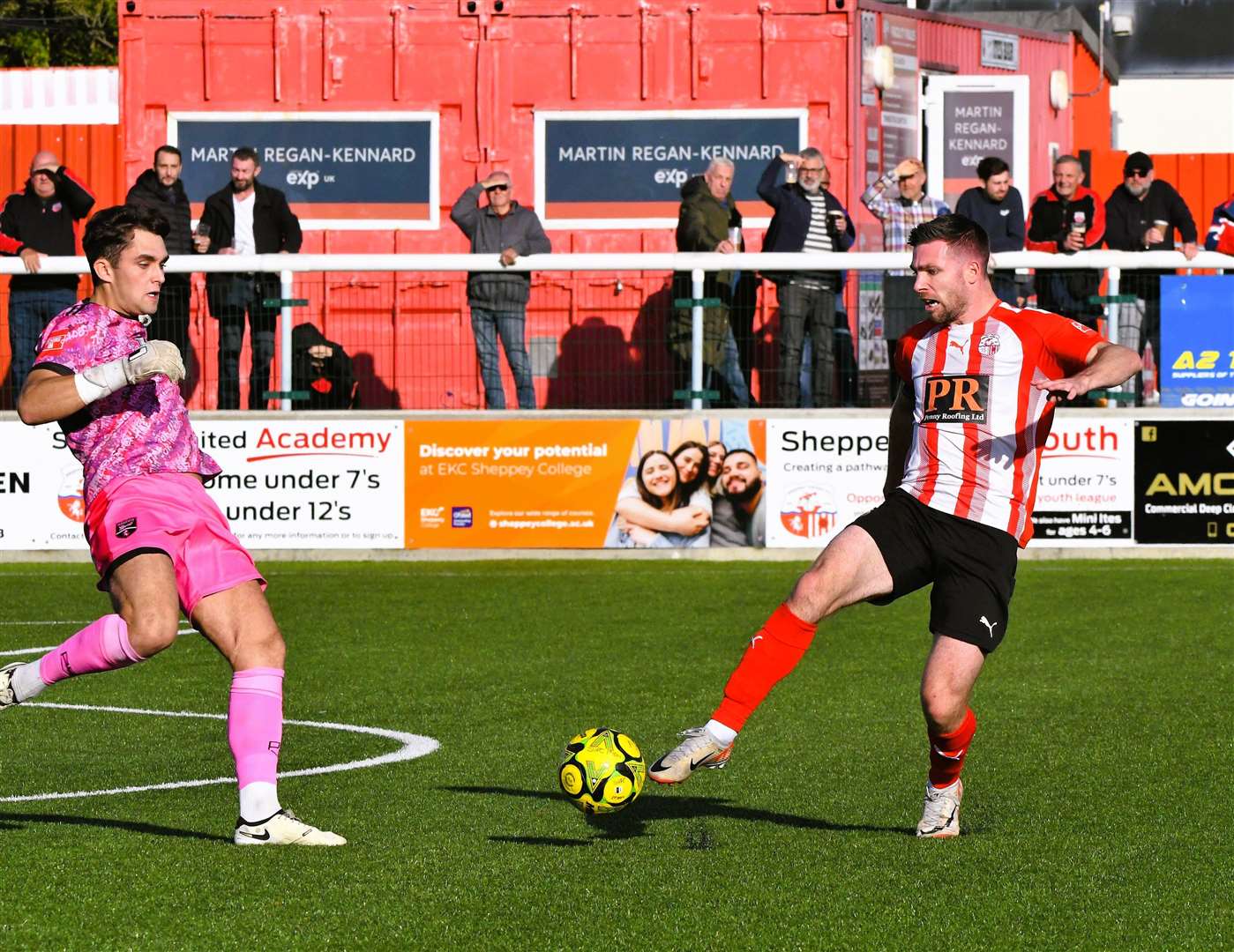 Sheppey skipper Danny Leonard attempts to round Margate goalkeeper Tom Wray. Picture: Marc Richards