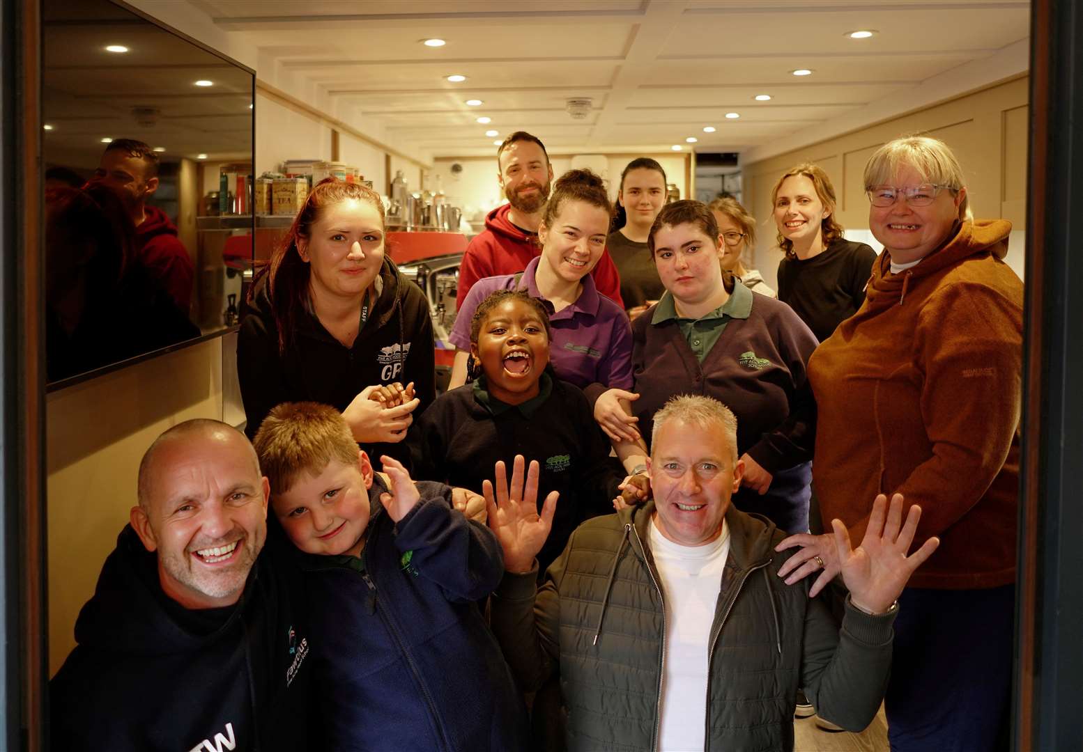 Headteacher Tim Williams, project manager Jeremy Harris and principal Peggy Murphy with staff and children inside the carriage. Picture: Five Acre Wood