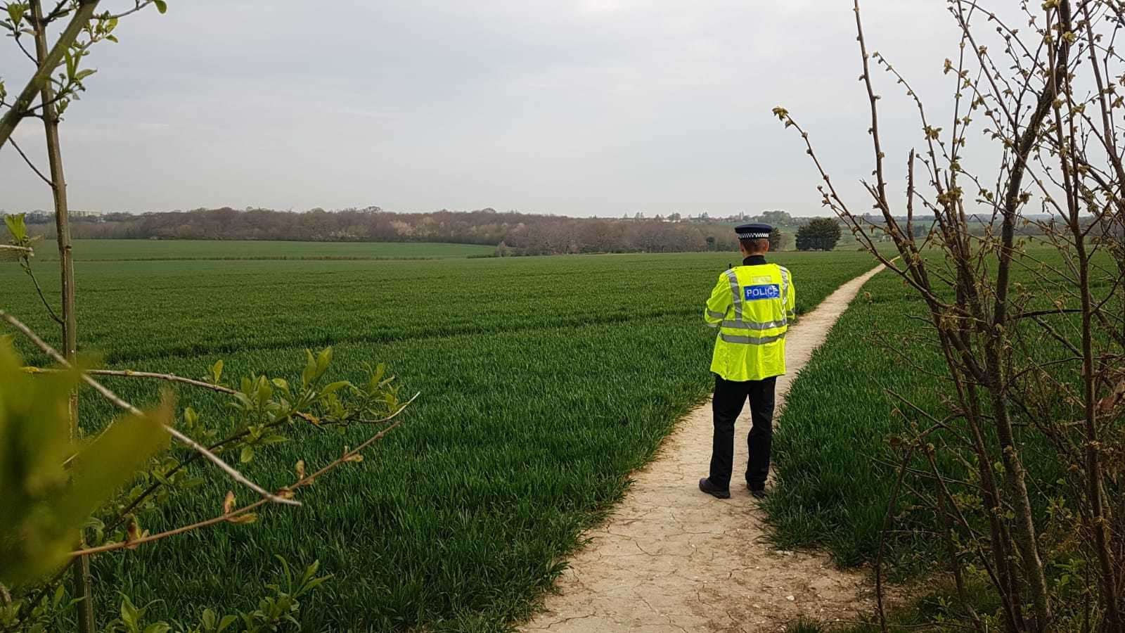 Police guarding the crime scene in the aftermath of Julia's death