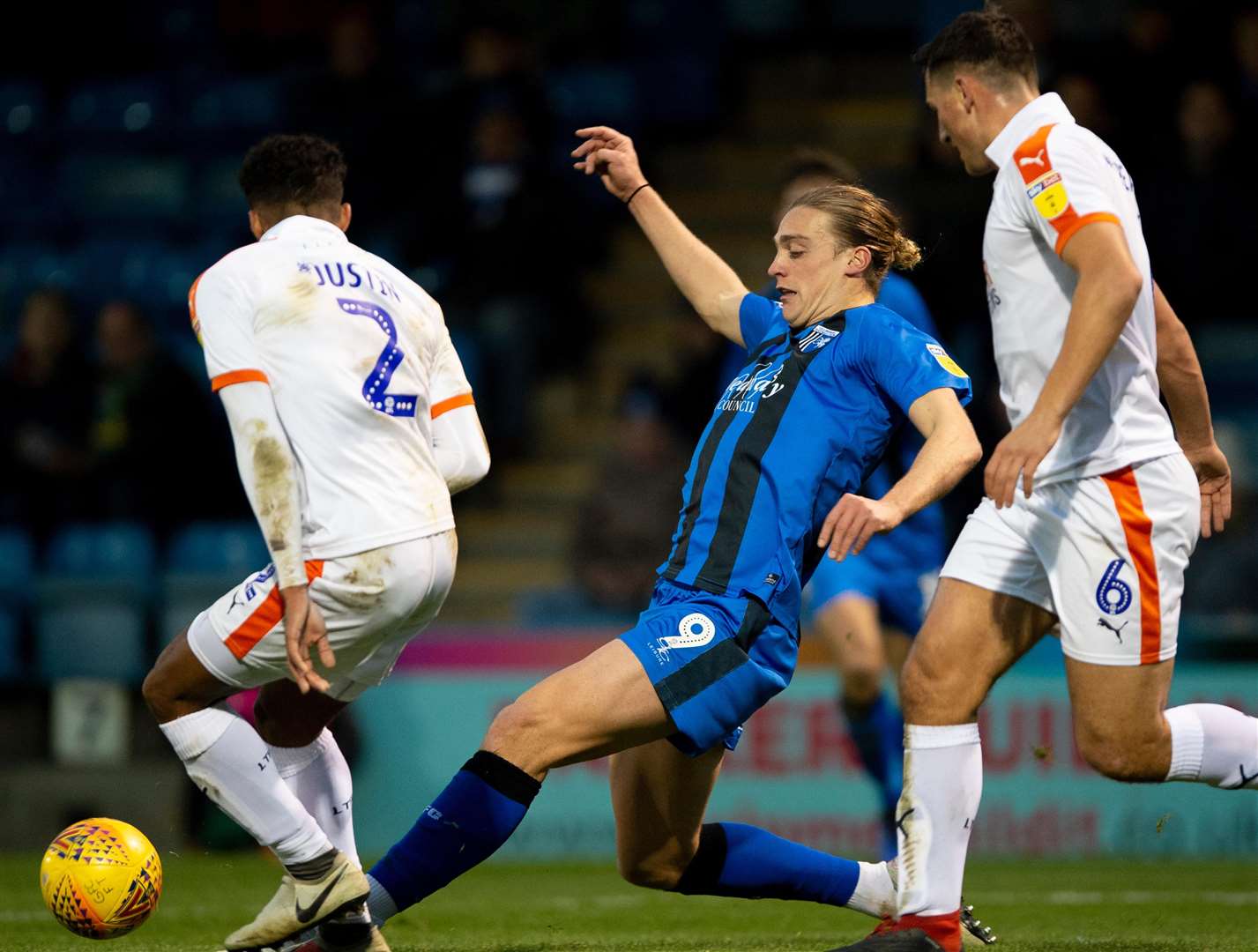 Tom Eaves stretches to the ball in front of James Justin and Matty Pearson Picture: Ady Kerry