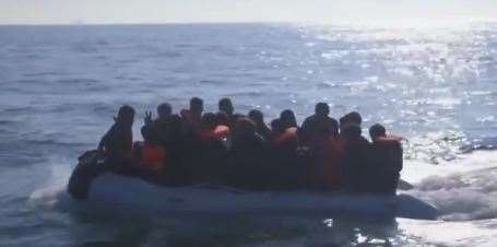 Nigel Farage's video shows the migrants crammed into a boat with water lapping over it yesterday