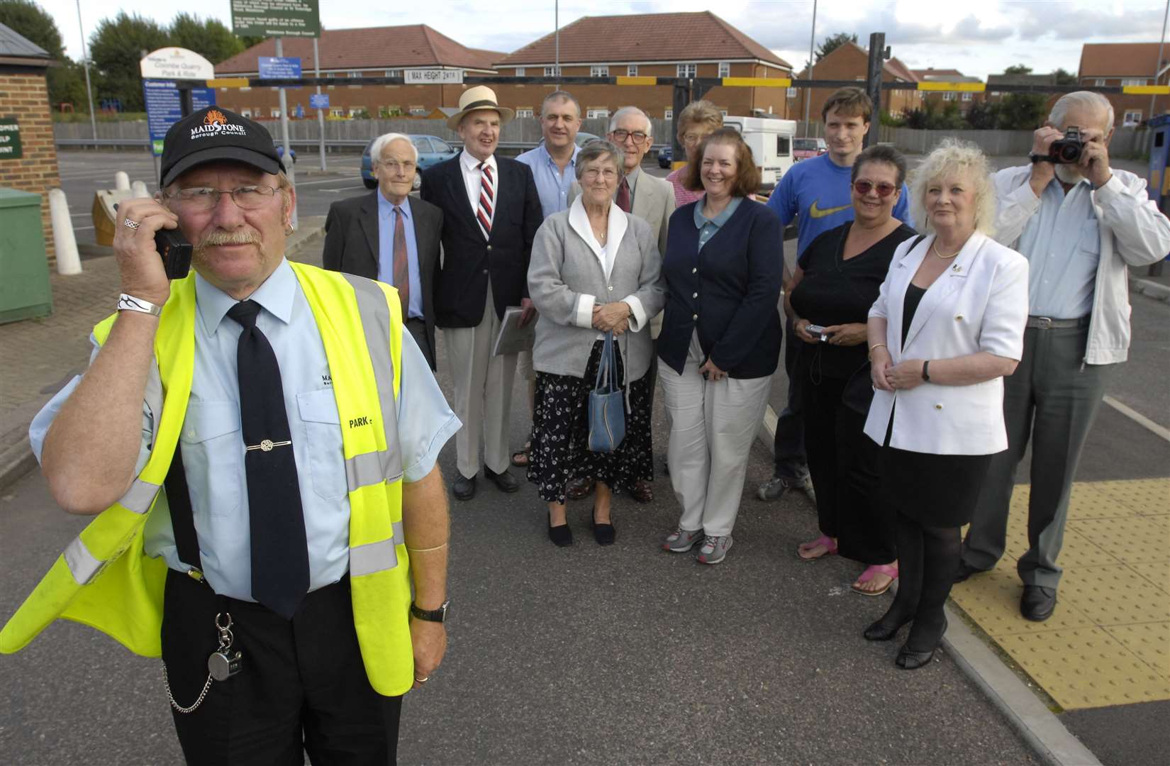 Dave Ellis, from the parking office, checks his radio for the last time as some of the last travellers wait at Coombe Quarry in 2007