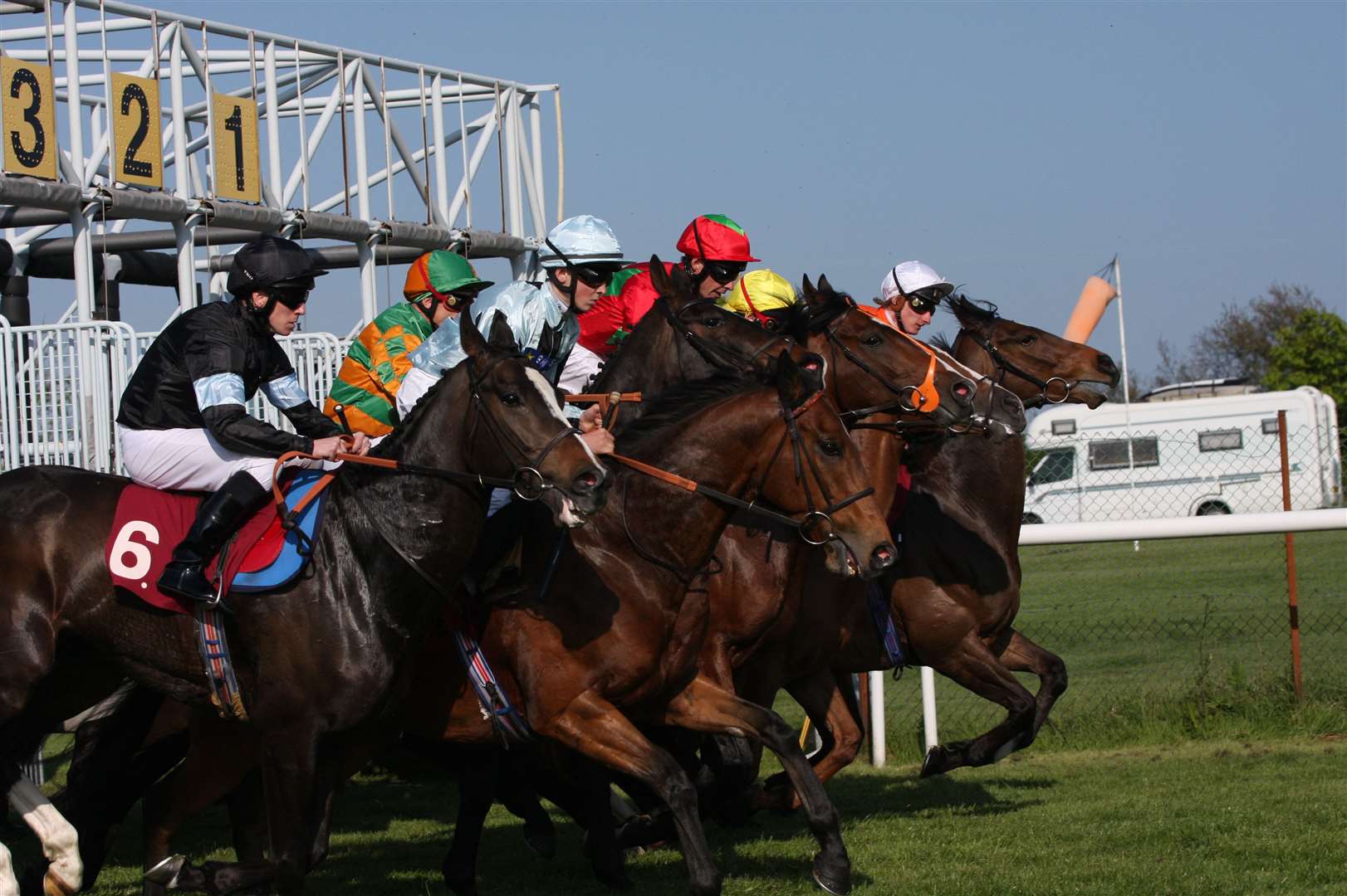 Horses in the 5.05 Ladbrokes.Com Handicap Stakes burst from the starting stalls. Picture: Chris Denham