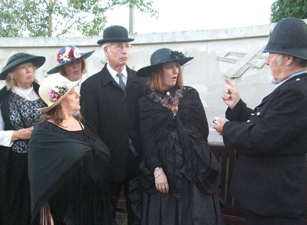 Big Fish Arts actors wearing costumes from the First World War period, which they are inviting people to dress up in for the Promenade Festival