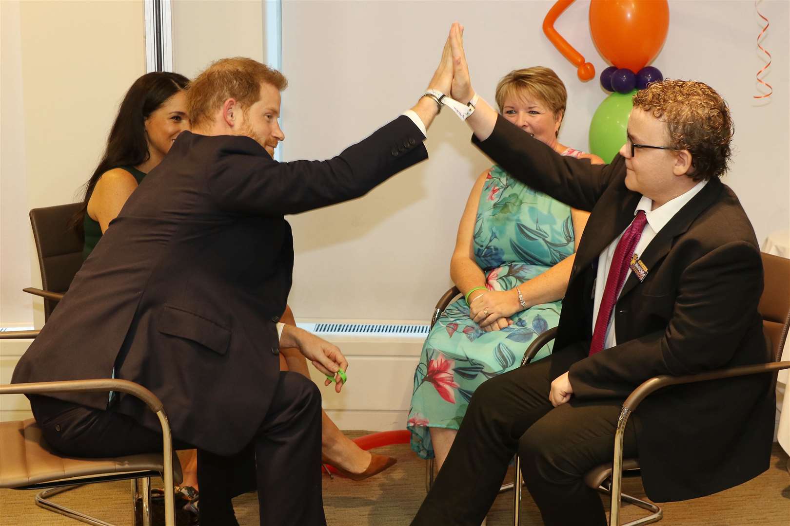 Strood resident Oakley Orange high fives Prince Harrys. Pictures courtesy of WellChild Awards